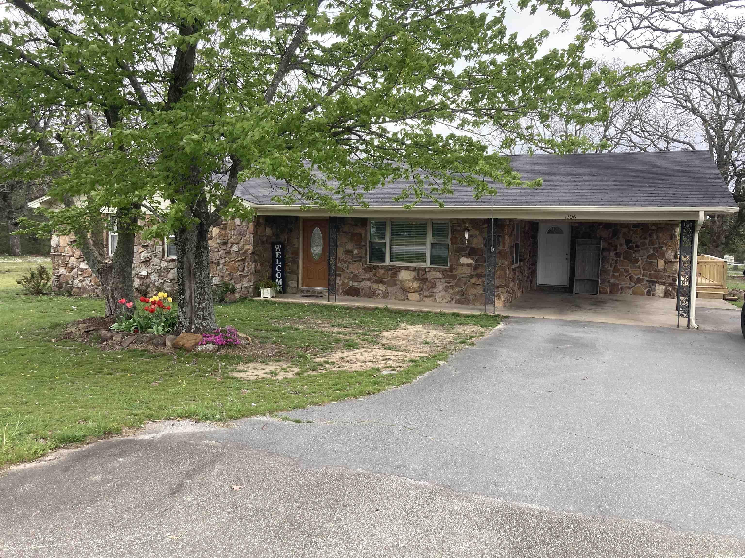 This updated home is located outside city limits and is just the right price!  As you walk inside, you'll see the living room that flows seamlessly into the kitchen.  There is a large island in the kitchen that comes with chairs to match. Updated cabinets.  The refrigerator conveys with the house.  The 3 bedrooms include a master with his and her closets and private bathroom with walk-in shower.  You'll love the large laundry room that has plenty of room for folding clothes.  There is also a second living area that could be a den, game room, office, or even an extra bedroom. New LED lighting throughout the house.  Out back, there is a deck that is perfect for sipping coffee in the mornings.  Got pets?  No problem.  The backyard is fully fenced, and even has room for a chicken coop.  Call or text today for a showing. Agents, see remarks.