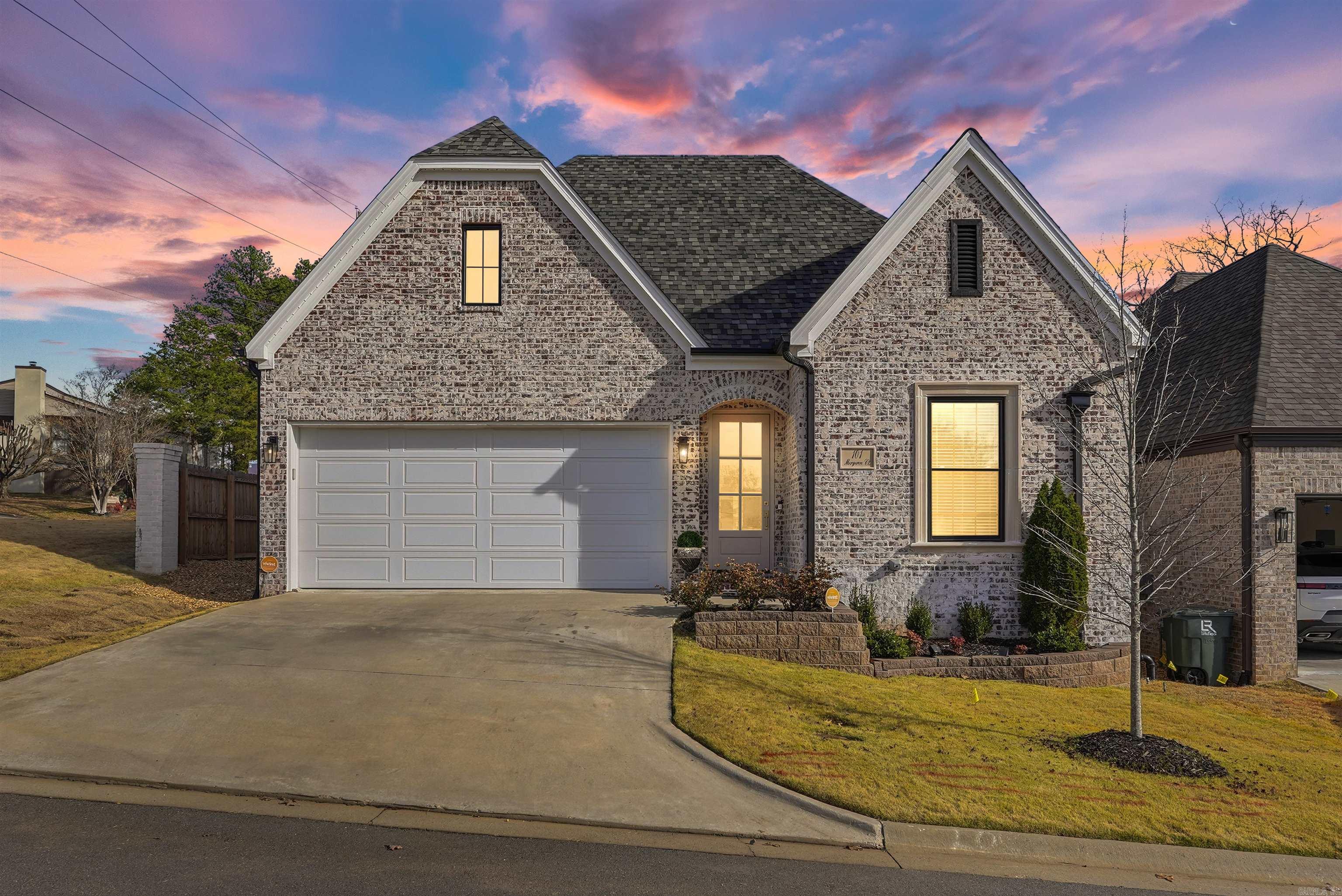Beautiful one-story home located in an exclusive, gated patio home community in the heart of West Little Rock (gate to be installed soon). This home offers timeless European-inspired architecture and energy-efficient construction. Inside, white oak hardwood floors (extending into the primary bedroom), 10 ft ceilings, and graceful arched entryways create a warm ambiance. The open floor plan features a gourmet kitchen with quartz countertops, a Bosch gas range with vent hood, dishwasher & microwave flowing into the dining room and great room with a color-controlled LED fireplace. The primary bedroom suite includes a sitting room or home office, luxury spa bathroom with dual sinks, designer mirrors, soak tub, frameless glass shower & private water closet - plus a walk-in closet with built-in chest of drawers. Two guest bedrooms are privately positioned sharing a well-appointed hall bathroom. The backyard features a covered patio, wooden fence, sprinkler system, Zoysia grass and evergreen trees.The POA maintains the gate, common areas such as the Belvedere gazebo, and private streets. Selling bonus: $6,000 toward buyer closing costs and prepaid expenses with accepted contract by 3/31!!