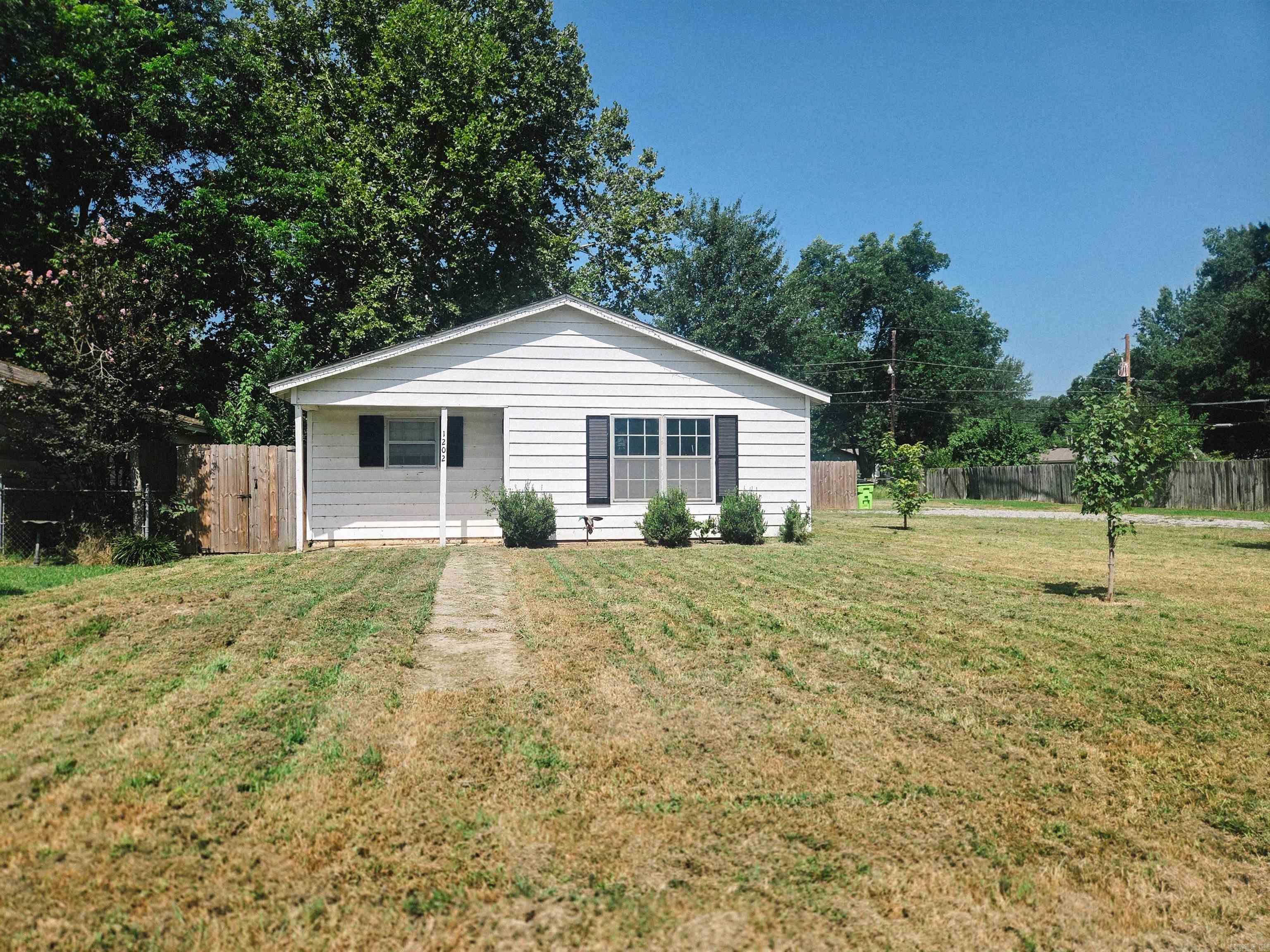 Whether you're looking for your first home or your next investment, this affordable 3-bedroom, 1.5-bath property offers approximately 1257sqft of living space, with several recent updates already completed. Features include new flooring, updated kitchen and bathroom finishes, an eat-in kitchen, and separate laundry space with pantry storage. Outside you'll find a large, partially fenced yard with a storage building and treehouse. Make this home yours today!