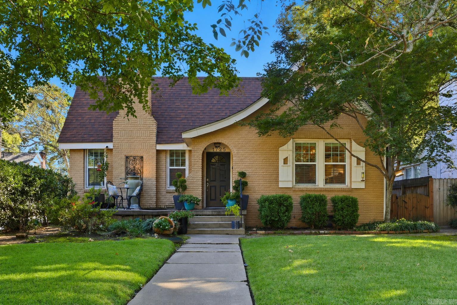 Welcome to this timeless Heights home where historic charm meets modern comfort. The inviting living room features rich hardwood floors, classic wood shutters, and a fireplace that anchors the space. The open kitchen and dining area offer granite countertops, stainless steel appliances, and a generous breakfast bar perfect for gathering. A chef’s dream, the kitchen includes a Bluestar gas professional range and a JennAir dishwasher. Three bedrooms and an updated bath, plus a convenient half bath, complete the main level. The thoughtfully designed upstairs BONUS SPACE with a private entrance, an additional bedroom and bath, office/living space, a charming reading nook, and additional storage, ideal for guests, a home office, or rented for additional income.  Recent updates include a new roof (2023), a tankless water heater, and an upgraded 240V electric panel for home charging an electric car. Enjoy the fully fenced backyard with an automatic gate, 2-car parking pad, sprinkler system, and storage building that conveys if the buyer wants. Forest Park School Zone and a short stroll to all the Heights favorites!
