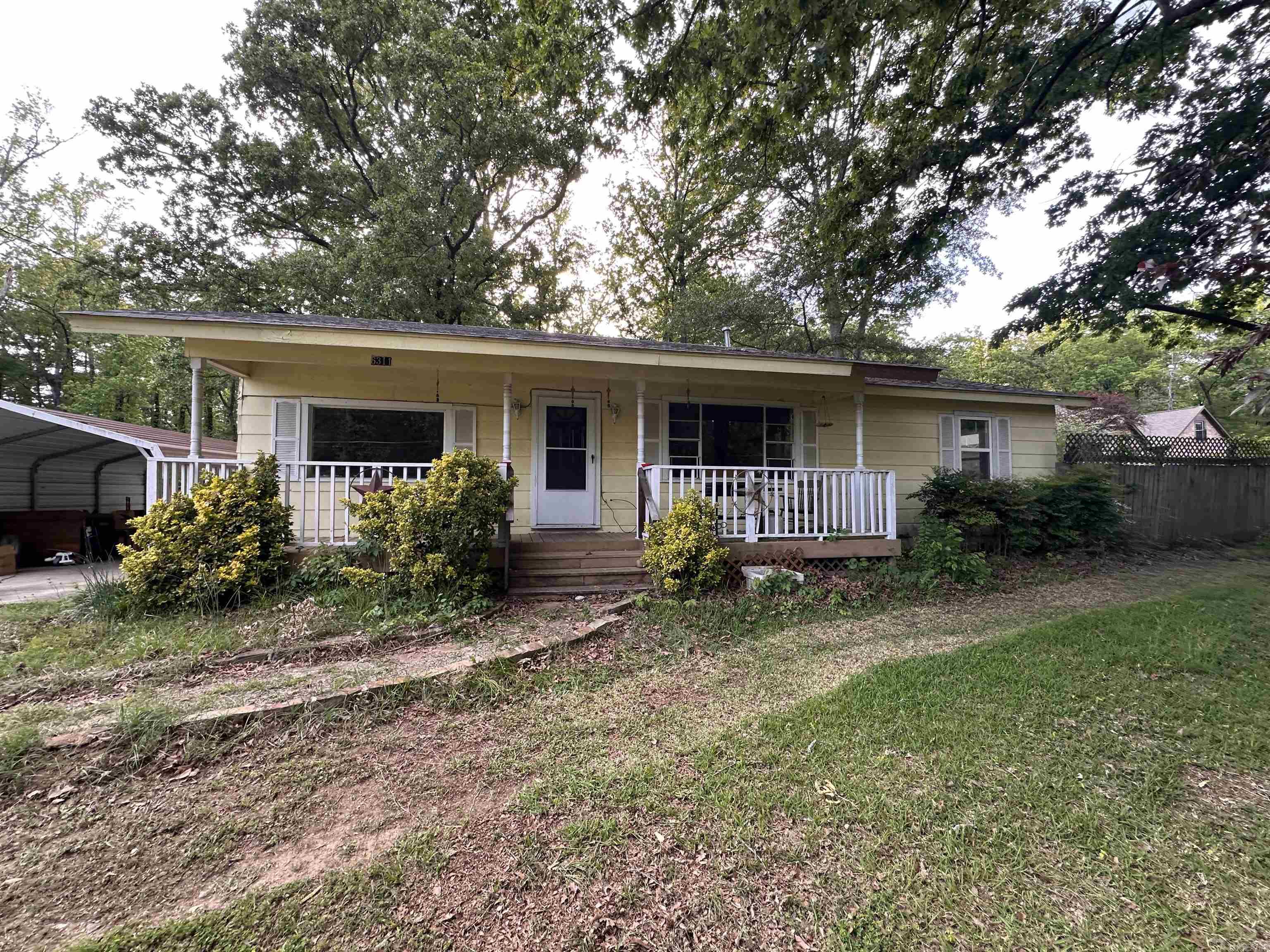 INVESTOR'S DREAM COME TRUE! This spacious 4-bedroom, 2-bathroom home offers incredible potential and versatile living options. A major highlight is the in-law quarters added to the side of the house, making it the perfect setup for multigenerational living or a rental opportunity.The home features a charming covered front porch. Interior highlights include wood & tile flooring throughout. The roof is approximately 5 years old. At closing, the property will be resurveyed to include extra land in the back, providing even more value and space. Priced to sell AS-IS. Don't miss out on this unique opportunity!.