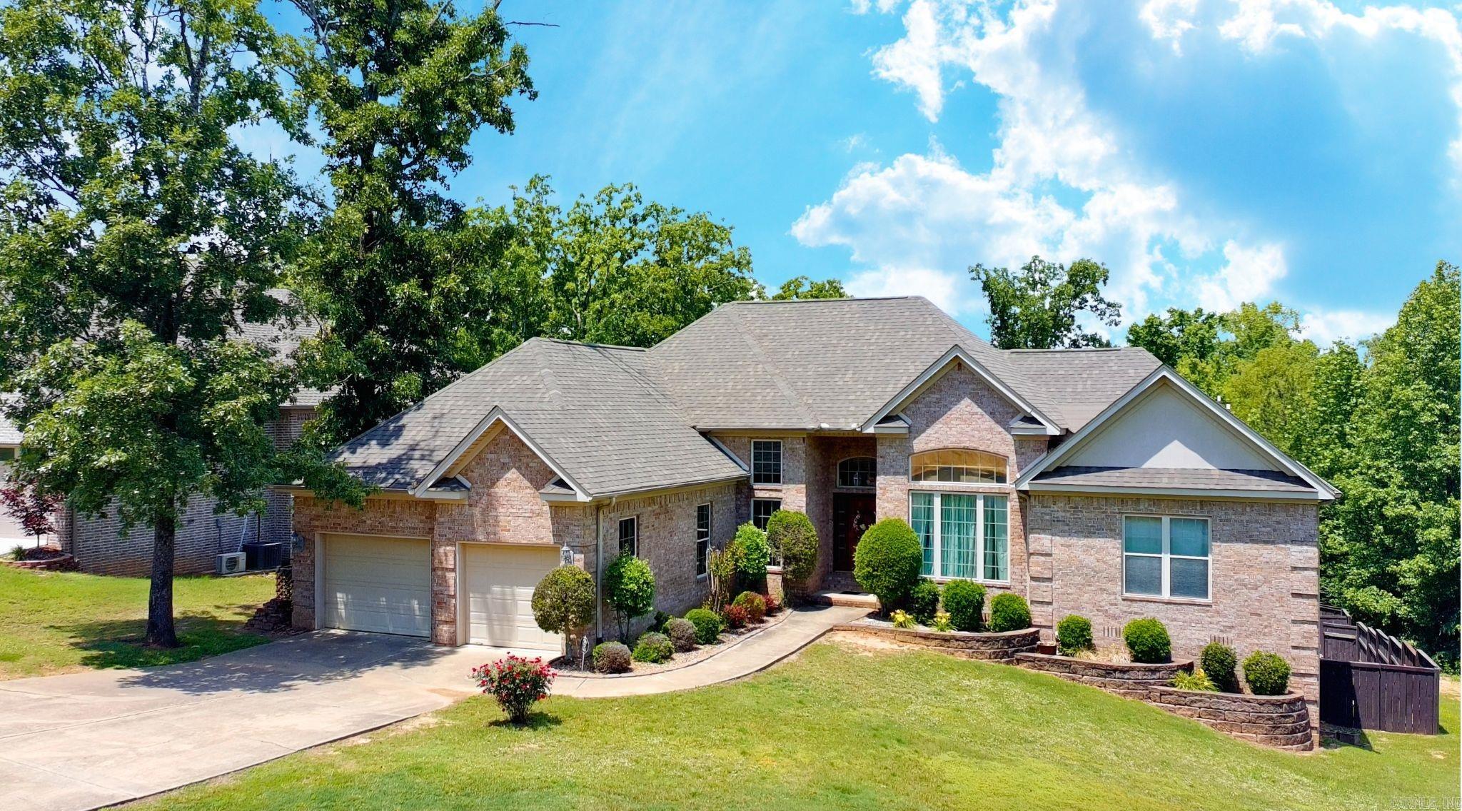 Welcome to this stunning Greystone home filled with charm and space to enjoy every day. The inviting entry opens to a bright open floorplan with high ceilings, detailed trim work, crown molding, and an abundance of windows bringing in natural light. Start your mornings with coffee in the kitchen or step out onto the elevated deck and enjoy peaceful views of your private greenspace where deer are often seen. The spacious primary suite offers a relaxing retreat with dual vanities, a whirlpool tub, and separate shower. Recent updates include a new roof in 2023, new carpet in 2025, and a new water heater in 2025 giving you peace of mind. The backyard is made for living with a large privacy fence and concrete patio. With generous storage inside and out this home truly has room for everything and everyone.
