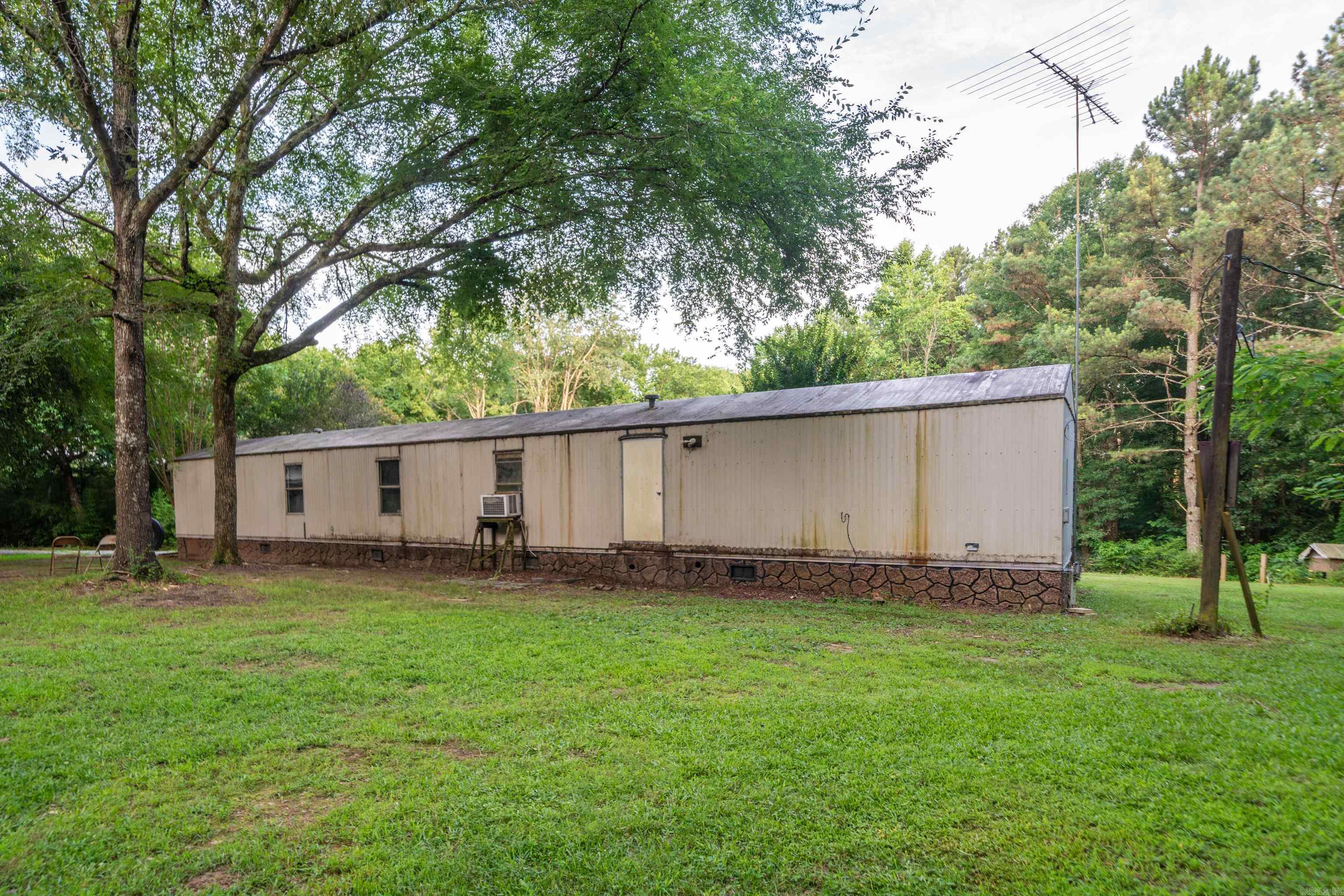 3-bedroom, 2-bath home offering 1,216 sq. ft. of living space on 3 beautiful acres. The property features a spacious 40' x 40' detached garage, providing ample room for vehicles, equipment, hobbies, or storage. Backing up to U.S. Government land, this property offers privacy, abundant wildlife, and direct access to outdoor recreation. With endless possibilities and a prime location in the Lake Hamilton School District, this is an excellent opportunity for hunters, outdoor enthusiasts, or anyone seeking peaceful country living.
