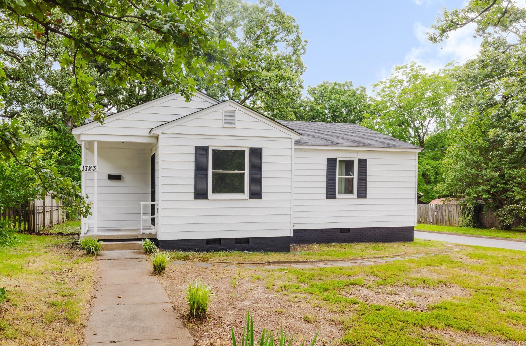 Updated Little Rock home with fresh finishes throughout! This property features bright living spaces, neutral paint, updated flooring, ceiling fans, recessed lighting, and an updated kitchen with white cabinetry and modern touches. Enjoy a spacious fenced backyard with plenty of room for outdoor use. Conveniently located near local amenities, schools, shopping, and major roadways.