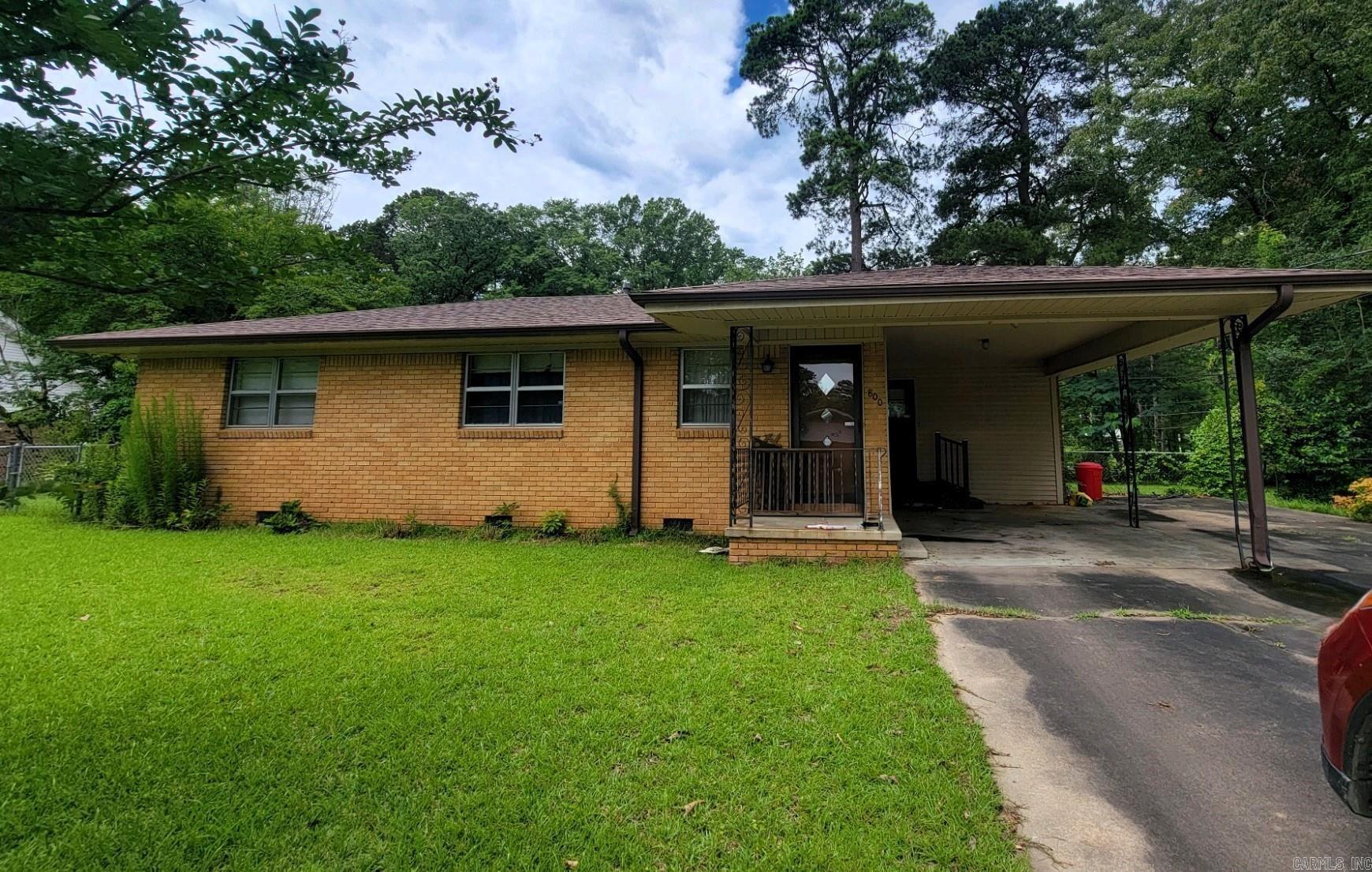 Great investment opportunity! Large corner lot! Fenced in back yard! Original hardwood floors! Enclosed sunroom! Two storage buildings! With very little work, this would be the perfect home for anyone!