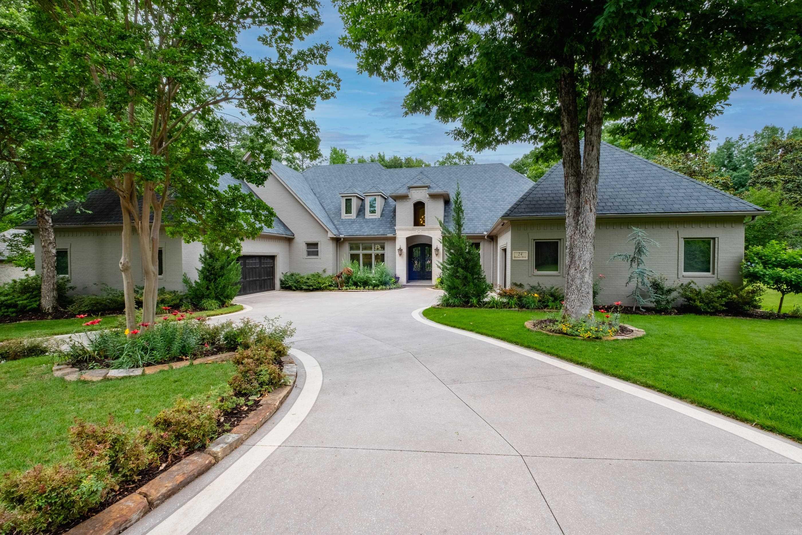 This is a rare opportunity to own a meticulously updated home in an established neighborhood.  The outdoor living space is amazing with Western Cedar beams and kitchen with large gas grill, gas stove, gas fireplace, ceiling mounted heaters and fans along with 3 hole putting green surrounded by fully landscaped yard with new sprinkler system. The interior of the home was completely remolded in 2021 with custom cabinets, all new lighting, floors, paint, carpet on stairs and theater room.  Master suite has wet room with freestanding tub and new custom cabinets. Sellers added walk in formal pantry as well as Subzero refrigerator, 60" Professional Wolf double oven, Wolf drawer microwave, Wolf warming drawer, Two drawer under cabinet mounted refrigerator, wine refrigerator, nugget ice machine, Bosch low decibel dishwasher, stainless sink, disposal, instant hot water dispenser.  14' Island with seating covered in beautiful Quartz.  Tons of storge, under cabinet lighting.  Two of the HVAC units were replaced in 2022 and 2023. Exterior of the home was painted in fall of 2025. Storm shelter located in garage.  Roof is being replaced in the next few weeks with a Class 4 impact-resistant roof