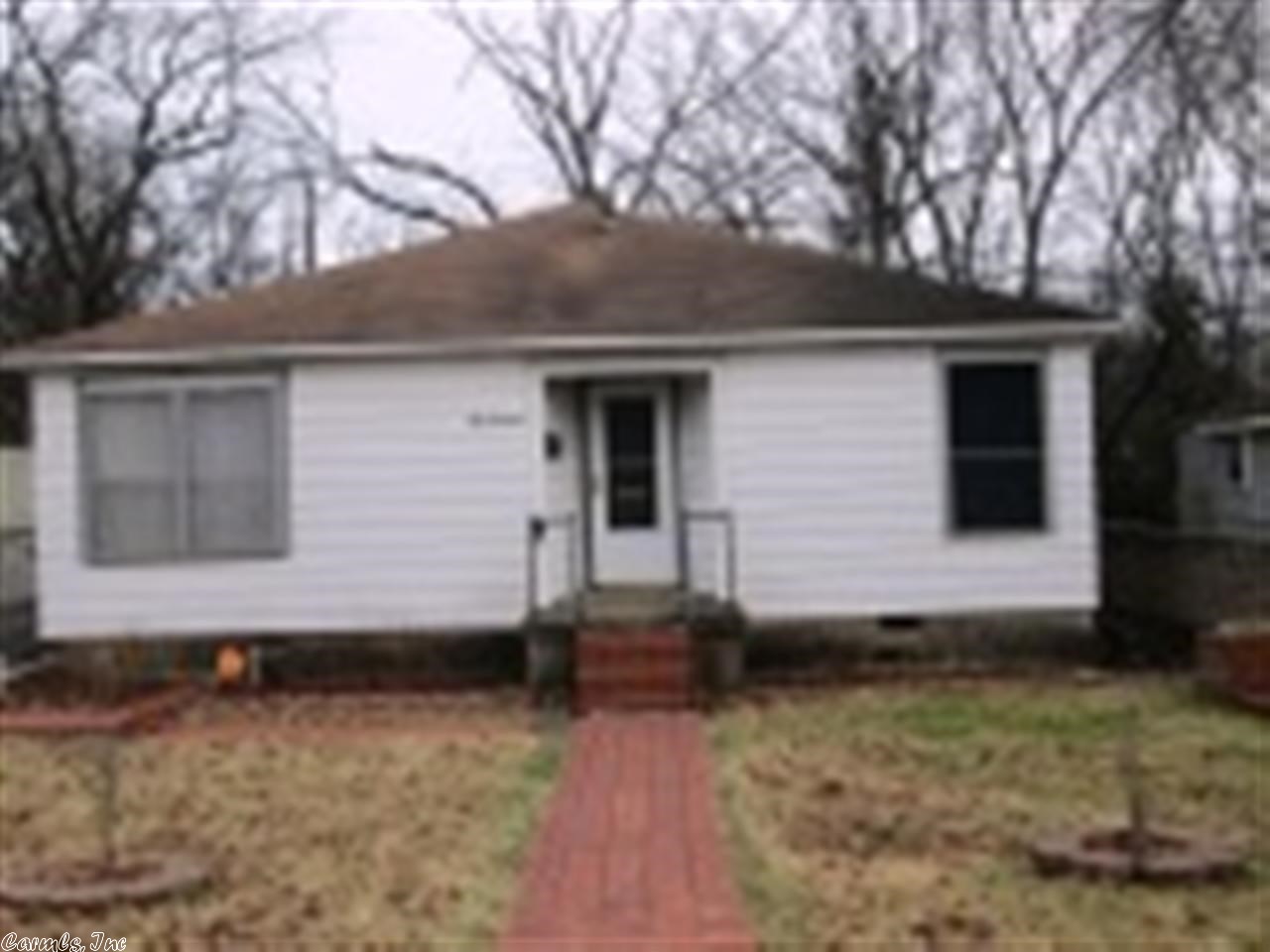 Excellent investment property or good starter home. Located only moments away from UAMS and VA Hospitals. Roomy 2 bedrooms, 1 bath property with nice features. Note the private backyard area and deck, detached garage or workshop and hardwood floors. House exterior is maintenance free. House is prices below appraised value. Inspections are welcome, but property is being sold "AS IS!!" Owner will not turn on utilities for inspection-to be done with buyer's expense.