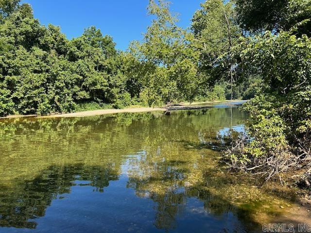 Welcome to your private slice of paradise. This breathtaking 45-acre property offers rare SYLAMORE CREEK FRONTAGE. With over 600ft of Creek frontage all together and crystal clear, year round water, perfect for fishing, Kayaking, and just simply hanging out and enjoying.Just a short distance from Mountain View and the beautiful White River. Float to the White River even. This land has stunning views. The 5 acre part is adjacent to the 40 acres and even has power on it cleared and ready for you to build. All you need is a well and septic. So many possibilities with this much land with the creek right there. Whether you are dreaming of a secluded getaway,an investment , a family retreat, or a forever home surrounded by natural beauty, this property checks all the boxes. Enjoy the sounds of the creek and those beautiful views forever. Don't miss this rare opportunity to own a piece of Sylamore Creek paradise. The seller is also selling just the 40 acres as well listed at MLS# 25029466
