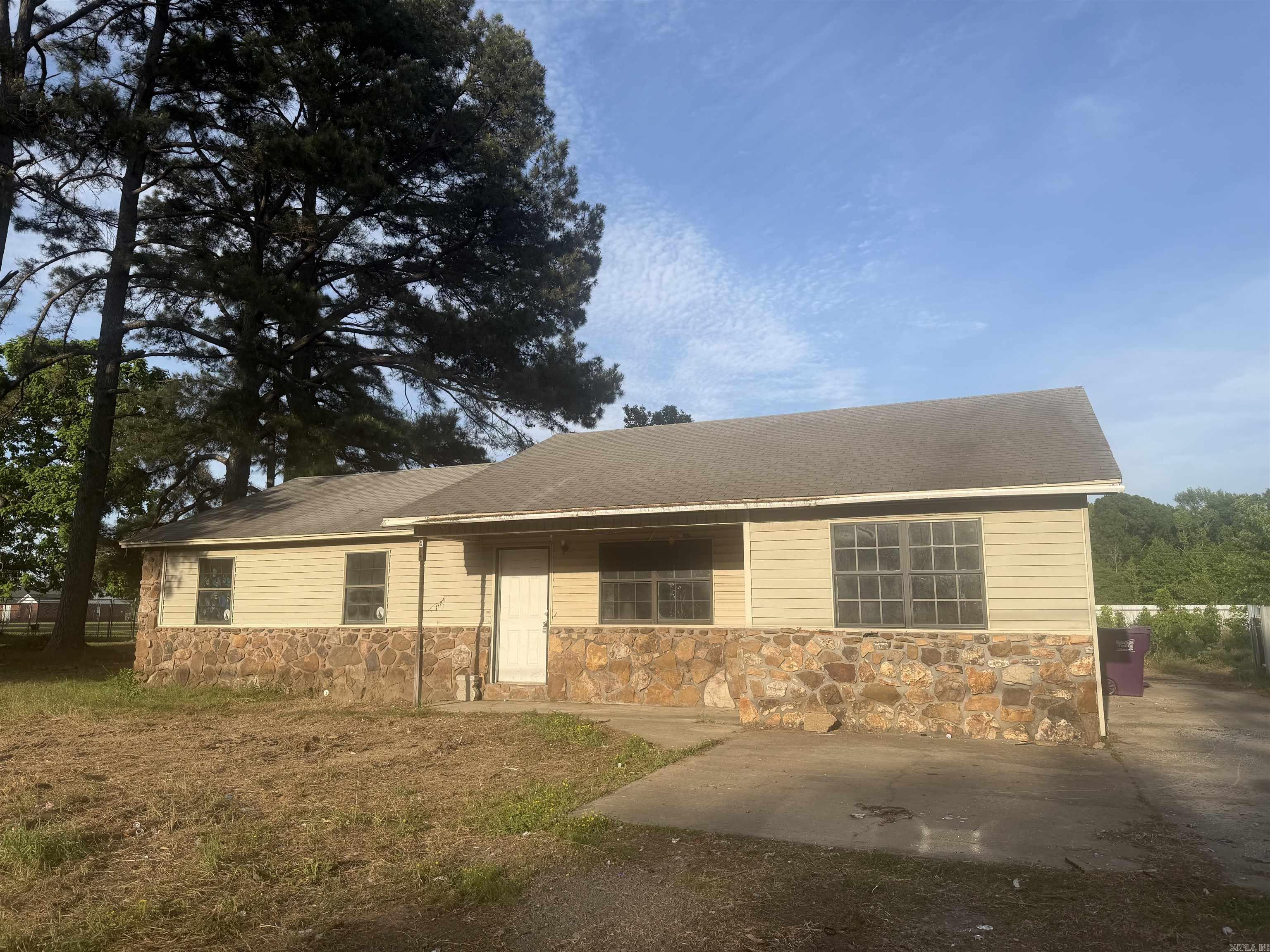 This property includes a 4 bed/2 bath home and a 1,500 sqft shop. Property is a fixer upper and is perfect for an investor. The shop is zoned commerical. Seller will consider selling both properties seperately.