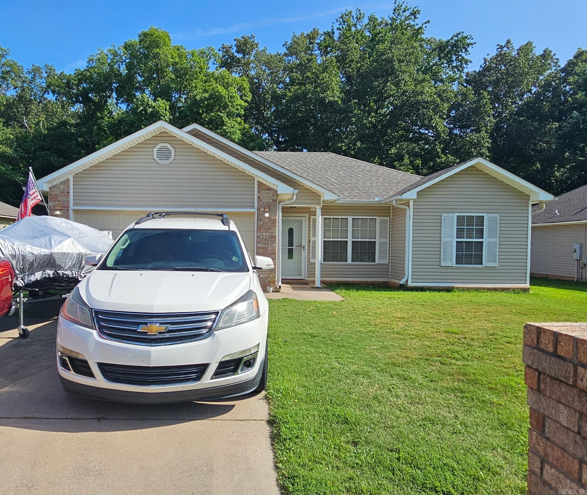 This home is located close to Ward Central Elementary. It is three bedroom and two baths with a double garage.  The large fenced backyard has a nice storage building.   It has solid surface counter tops.  This home has a a new architect. roof installed in 2024.