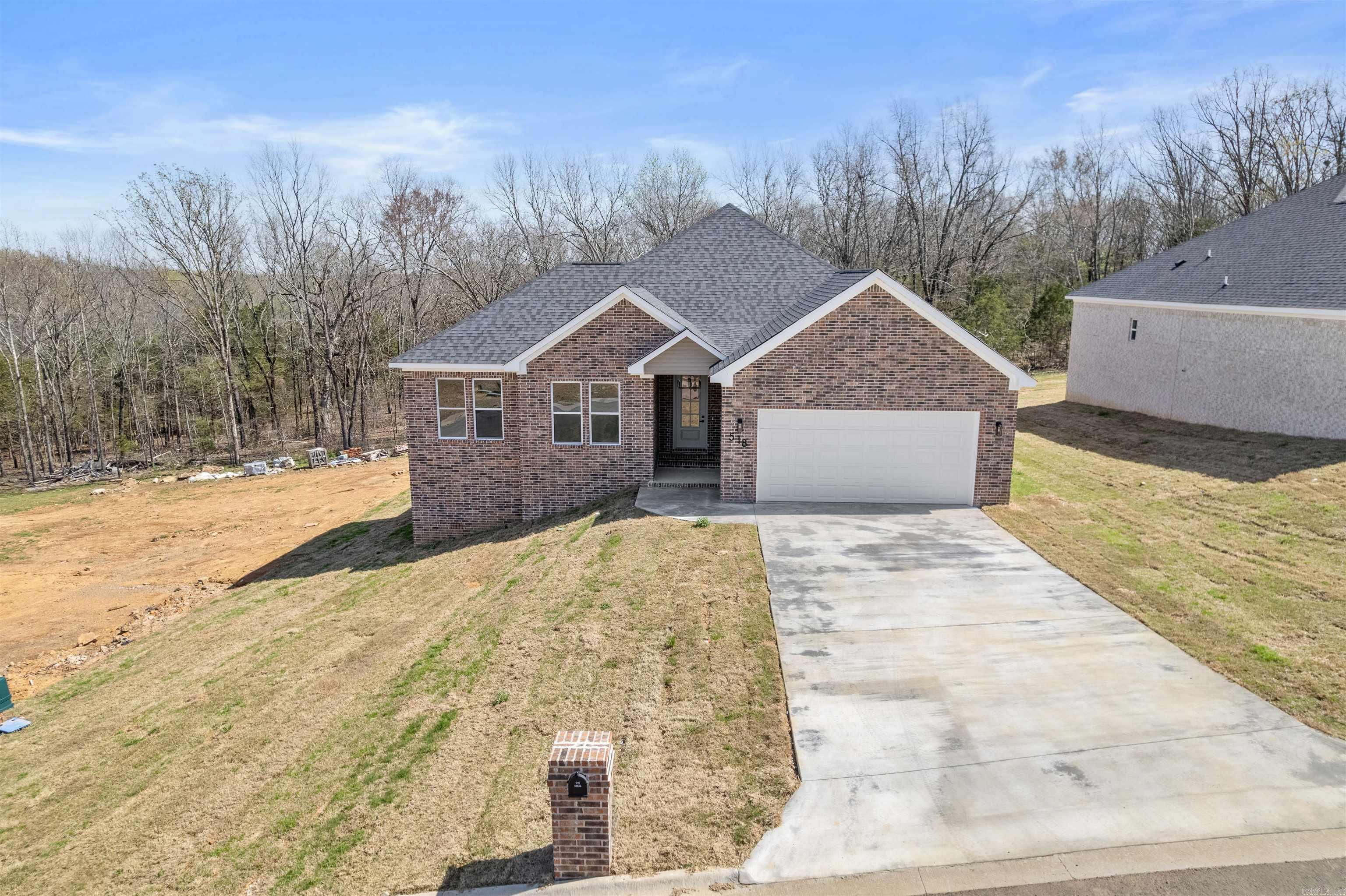 Welcome Home to this Stylish 4-Bed, 2.5-Bath home in George's Crossing! This gorgeous all brick home offers so much you must see in person! Do not forget the large lot with trees behind too. This home offers an ideal blend of soothing neutral tones w/just the right accents added throughout the home. The home boasts a large foyer from the front door to the living room. The living room opens up and is the center of the home. This ultra open concept is made for family memories, entertaining and easy flow getting about in the home. The stone countertops, tile backsplash and stainless appliances add just the right glitz too! Enjoy a backyard view from the dining room or step out onto the covered back patio too. Stepping into the bedrooms and bathrooms you will be impressed with the luxury vinyl flooring and spacious rooms. The bathrooms all are well appointed and show off a nice light and dark contrast that is just enough to grab your attention to the classy design. Do not miss out on this stunner of a home wrapping up in Feb 2026! See Agent Remarks.