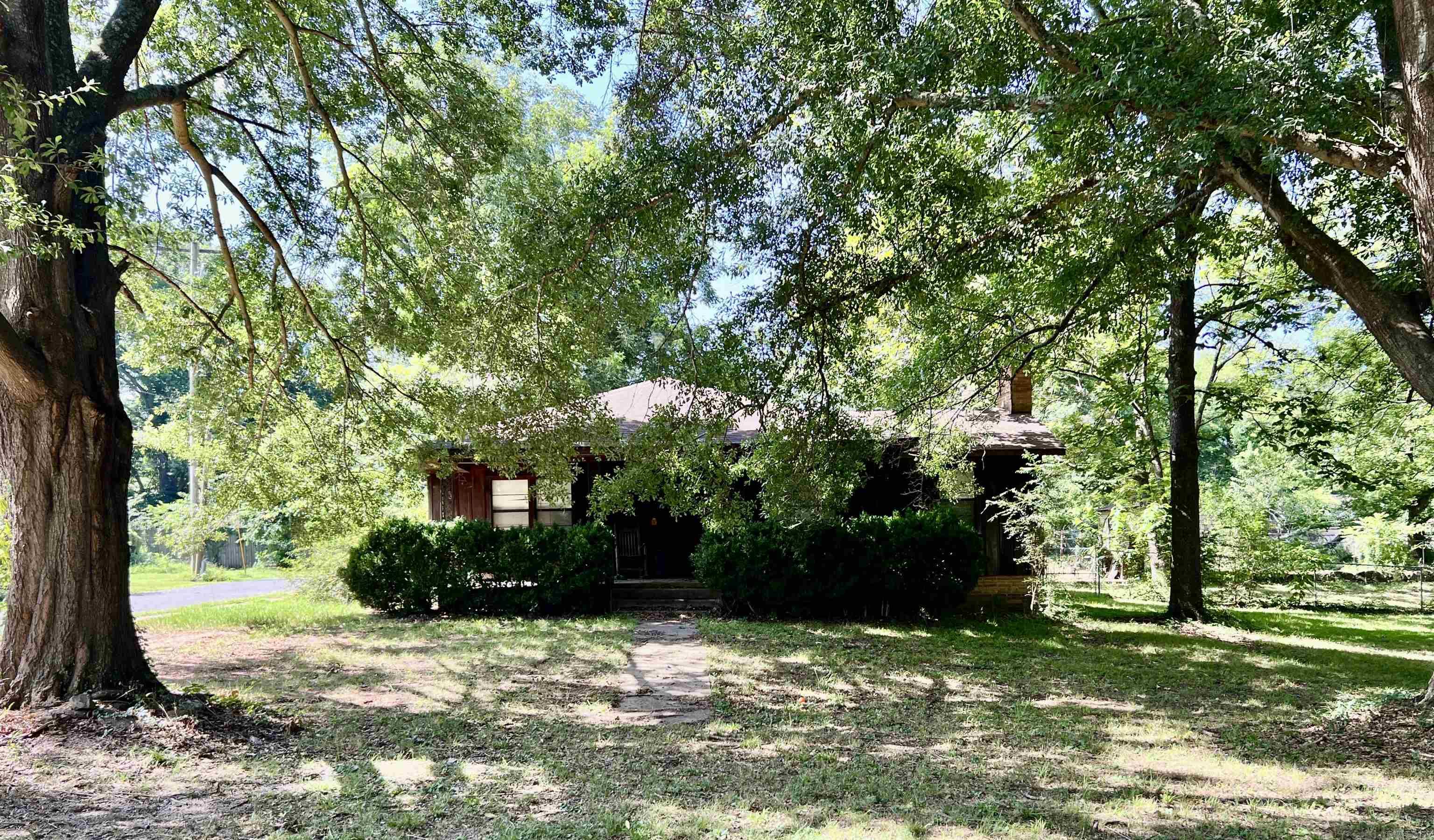 Conveniently located at 127 E. Mill Street in Malvern, this charming 4-bedroom, 2-bath home offers the perfect blend of comfort and accessibility. Situated just minutes from Downtown Malvern, the local public schools, and only a few miles from I-30, you'll enjoy quick access to shopping, dining, schools, and an easy commute.  Inside, you'll find a spacious layout with plenty of room for family living, guests, or a home office. Outside, relax on the welcoming front porch or unwind on the back porch overlooking the fenced backyard, ideal for children, pets, or entertaining. A detached storage building provides additional space for tools, lawn equipment, or hobbies, while the two-car parking slab offers convenient off-street parking. Whether you're a first-time homebuyer, growing family, or investor, this centrally located property is a wonderful opportunity to enjoy all that Malvern has to offer.