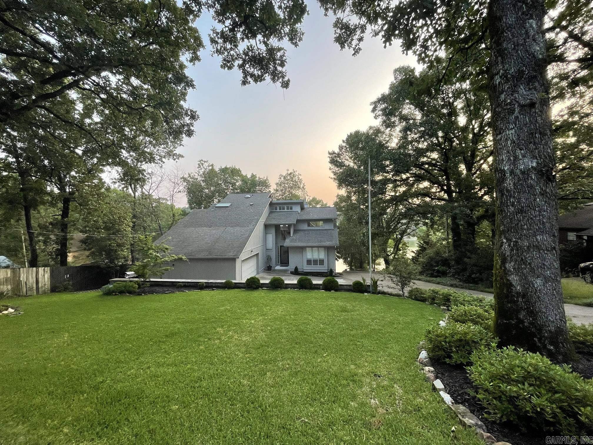 Looking for a charming waterfront property that offers a serene environment and breathtaking views? Look no further than this 2020 remodeled beauty offers plenty of space for you and your family to spread out and enjoy.  The home's beautiful design features an open floor plan that seamlessly blends the living, dining, and kitchen areas together, making it perfect for entertaining guests or spending quality time with loved ones. The kitchen is fully equipped with modern appliances, quartz countertops, and plenty of storage, making it a chef's dream come true.  The primary bedroom is a true retreat, featuring an ensuite bathroom and a private balcony that overlooks the water. Imagine waking up each morning to the sound of gentle waves and stunning views of the lake!  The outdoor space is equally impressive, with a large deck and patio area that's perfect for hosting summer barbecues or enjoying a quiet evening under the stars.   1936 Waterside is located in a quiet, family-friendly neighborhood that's just minutes away from all the amenities you could need. POA: https://lakewoodpoa.com/membership/