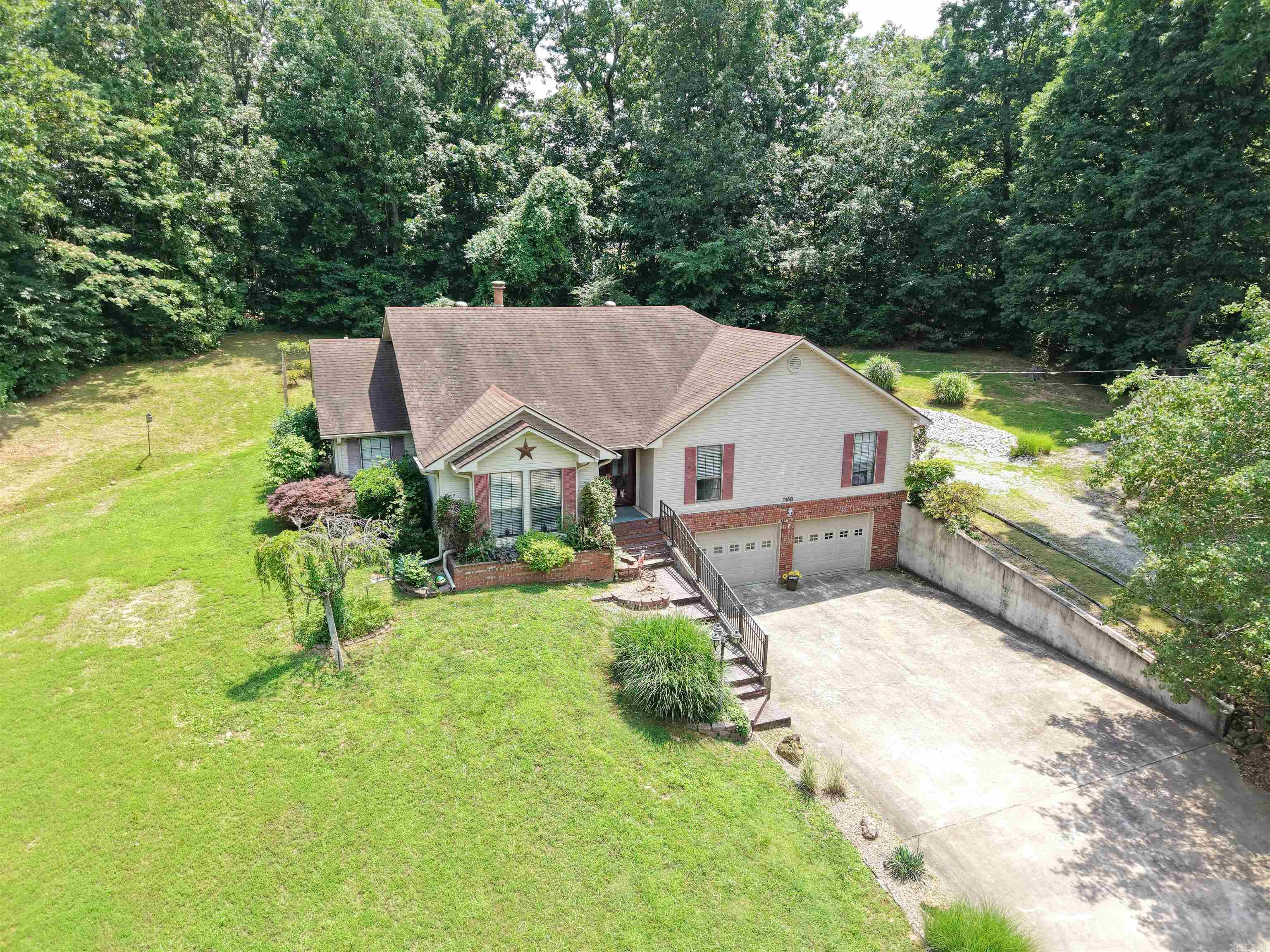 Welcome to 1410 Spinnenwebber Circle!  Located in one of Pocahontas' most sought-after subdivisions and within walking distance of Baltz Lake, this well-maintained 3-bedroom, 2-bath home offers comfort, convenience, and exceptional curb appeal. Built in 2003, the home features a spacious floor plan highlighted by a large family room with a gas log fireplace that flows seamlessly into the oversized kitchen with a large walk-in pantry. A formal dining room and second living room finish out the common areas.  The private primary suite offers a relaxing retreat with an attached full bath featuring a soaker tub, walk-in shower, and generous walk-in closet. Two additional bedrooms provide ample space for family, guests, or a home office. Outside, you'll appreciate the oversized two-car garage, beautifully landscaped yard, and fenced backyard. A second driveway provides convenient access to the rear of the property, where you'll find a quality storage building ideal for lawn equipment, hobbies, or additional storage needs. With its desirable location, thoughtful layout, and impressive outdoor amenities, this property is a rare opportunity in the Pocahontas market.