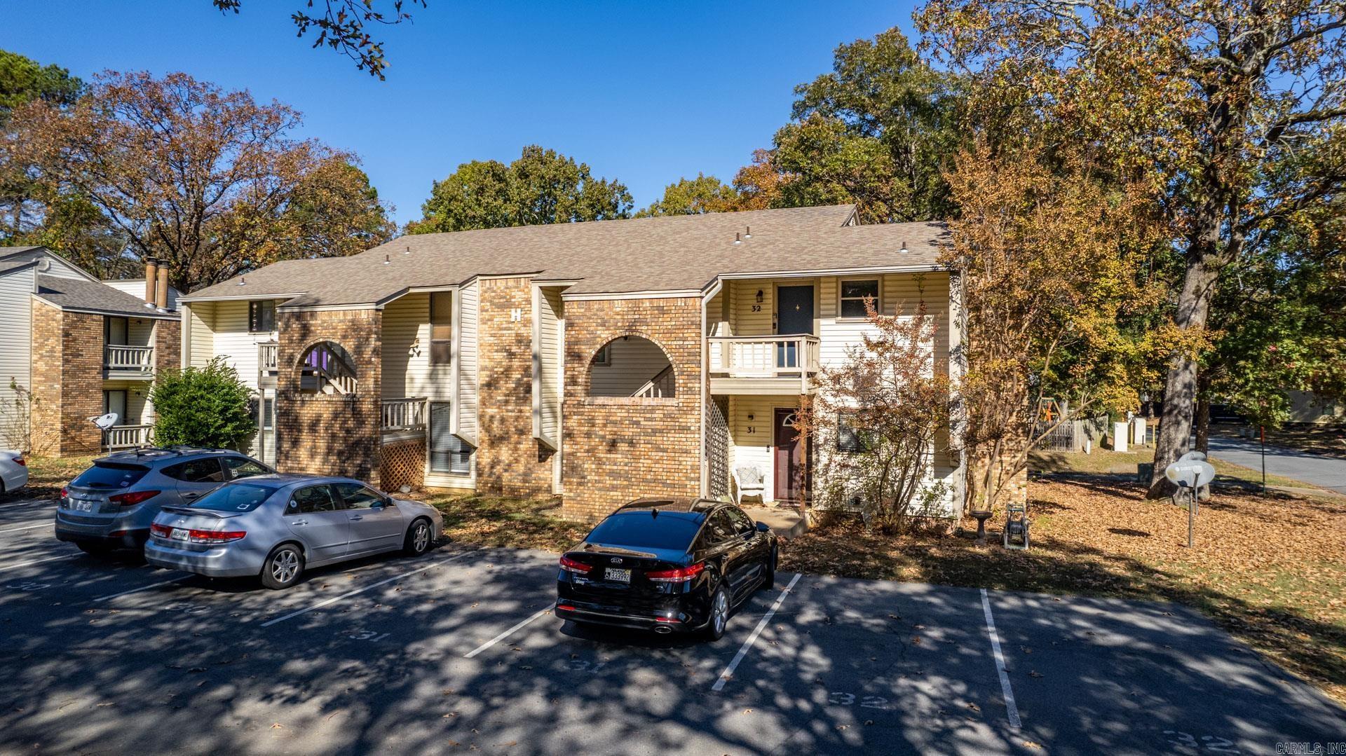 Priced to sell in Maumelle! This turnkey 2BR/2BA upstairs condo at Pine Forest offers 1,029 sqft featuring newer appliances, luxury vinyl plank and tile flooring, and fresh paint throughout. Relax on one of two private balconies and enjoy the convenience of two assigned parking spots. The low $220 monthly HOA covers trash, common area maintenance, and exterior of buildings including the roof—keeping ownership costs predictable. Investors take note: quality tenant in place through 02/28/2027 at $1,150/month delivers immediate cash flow that meets the 1% rule from day one. Listed at $110,000—nearly $20,000 below comparable units currently on the market in the same complex—this is a rare value play that won't last. Schedule your showing today! Agents See Remarks for Showing Info.