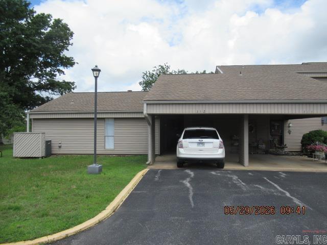 This beautiful ONE-LEVEL condo with a carport may be just what you need to relax and enjoy the beautiful community of Fairfield Bay, Arkansas!  Along with 2 beds there are 2 baths, including a Safe-Step walk-in tub/spa with shower.  The large room addition has great storage.  You'll have plenty of room to entertain.  It has been professionally cleaned, so you can move right in!  Walk to the Senior Center, the Hart Center, restaurants, and more.  AND there is a pool onsite.  Call to see one of the best condos in town!