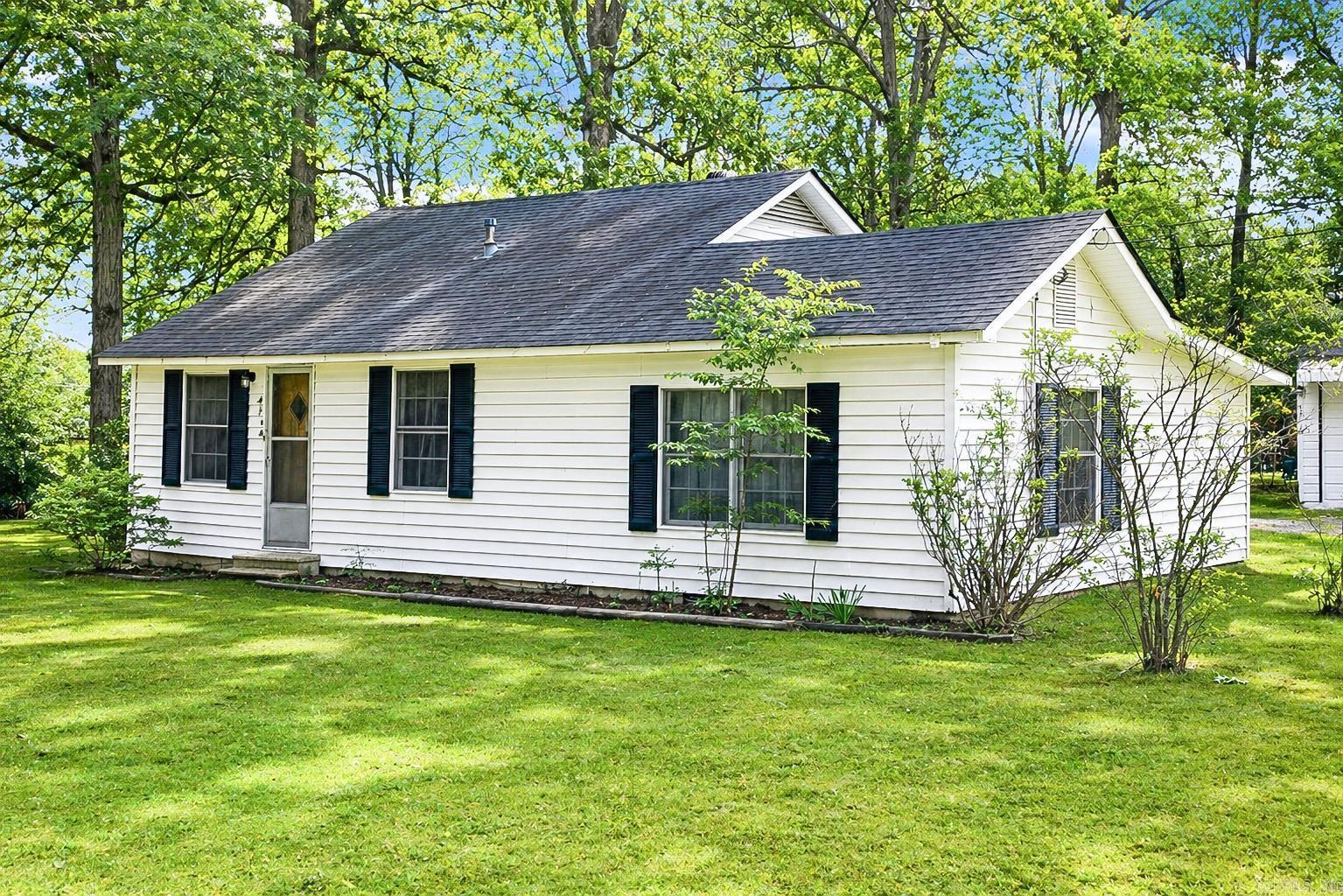 This well-maintained home offers extensive updates and a spacious layout designed for comfortable living. Situated on a large corner lot, the property provides plenty of room to build an additional shop or expand, making it a great opportunity for future growth. Inside, you’ll find an oversized primary bedroom along - with new flooring throughout and fresh paint. The home features smooth ceilings, updated lighting, and upgraded outlets with GFCI for added peace of mind. A new subfloor adds to the quality and durability of the recent improvements. The kitchen is equipped with a gas stove, and the home includes gas heat and a tankless water heater for efficiency and convenience. A new roof was installed in 2019. Outside, enjoy covered parking as well as a detached garage/shop, offering additional storage or workspace. Located in White Hall School District, this property combines updates, space, and flexibility—ready for its next owner.