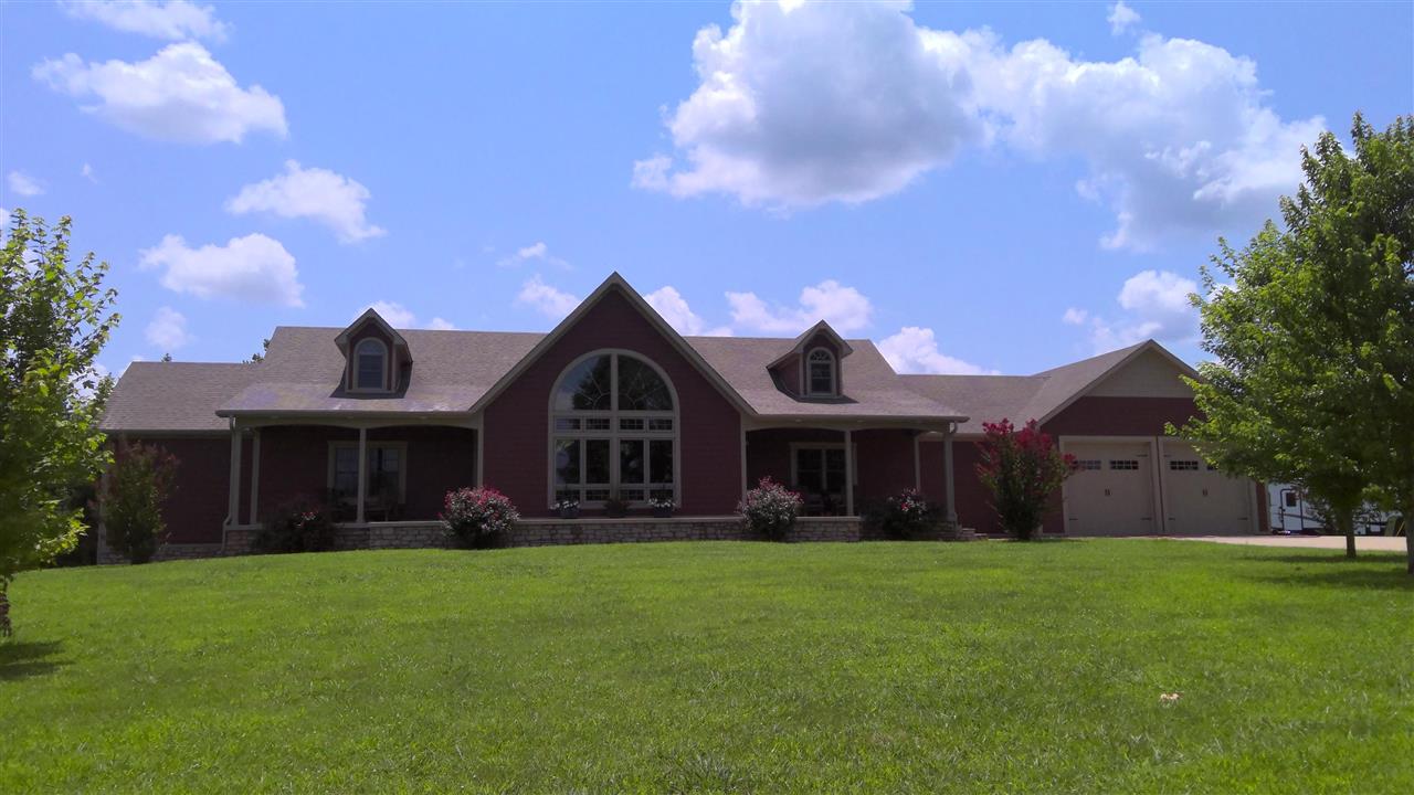 GORGEOUS 6 bed,3 bath,3 living,2 dining,2 laundry, 5500+/- Sq. Ft. total under roof of which 2,984+/-sq ft is on main level and 2584+/- sq ft fully finished walk out basement lodge style house built in 2014 on 165 Acre property with residential, timberland, and ranchland in Cave City, Sharp County, AR 72521. This stunning home features a large living room on the main level, vaulted ceilings and multiple gas log fireplaces.  In ground pool. 1,000 +/- sq ft guest house. MUST SEE! Acre source from new survey.