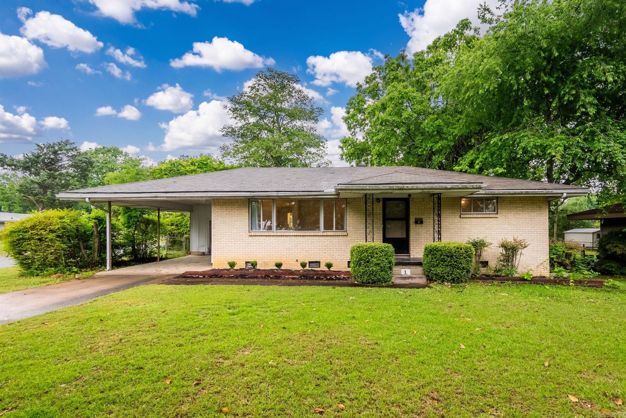 Great 3 bed 1 bath home with beautiful original hardwood floors, carport and a huge backyard.
