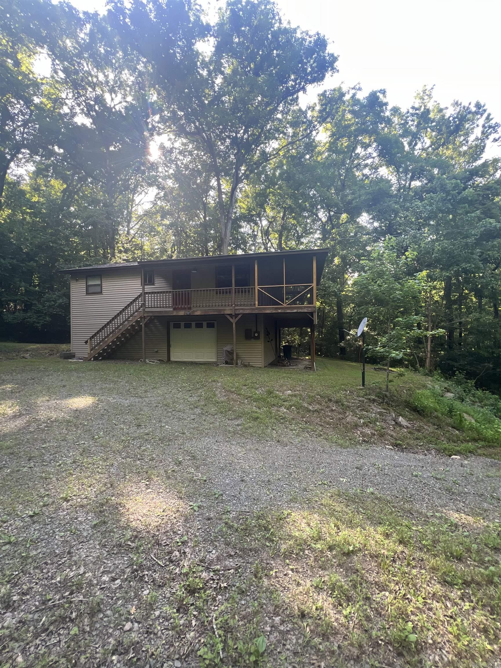 Peaceful, serene, tranquillity.  This cabin on the river has it all! Don’t let this gem slip away!  Two bedroom 1 and 1/2 bath with screened in porch across front of house to enjoy your coffee, the wildlife, and the flowing river below! New roof, new screens on porch, new siding all so you can just come and enjoy!  Call us today to schedule your viewing.