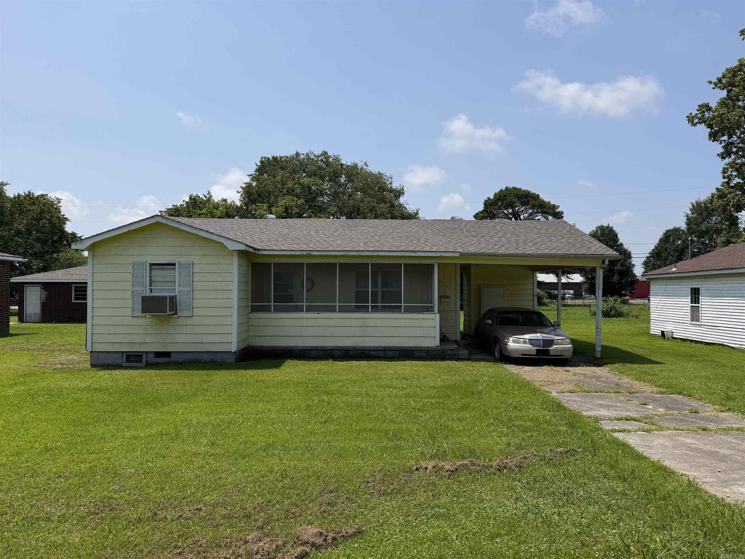 675 E. Jackson St., Piggott, AR 72454  Opportunity awaits at 675 E. Jackson St. in Piggott! This 3-bedroom, 2-bath home offers 1,272 square feet of living space on a 0.18-acre lot and is full of potential for investors, first-time buyers, or anyone looking to add their own personal touches. With good bones and a brand-new roof already in place, much of the heavy lifting has been done. The HVAC system is approximately 10 years old, providing added peace of mind.  Enjoy your morning coffee on the screened-in front porch or relax in the screened back patio, perfect for enjoying the outdoors year-round. A one-car carport adds convenient covered parking.  Whether you're searching for your next rental property, flip opportunity, or an affordable home to make your own, this property is priced to be a great investment opportunity. Don't miss your chance to unlock the potential this Piggott home has to offer!