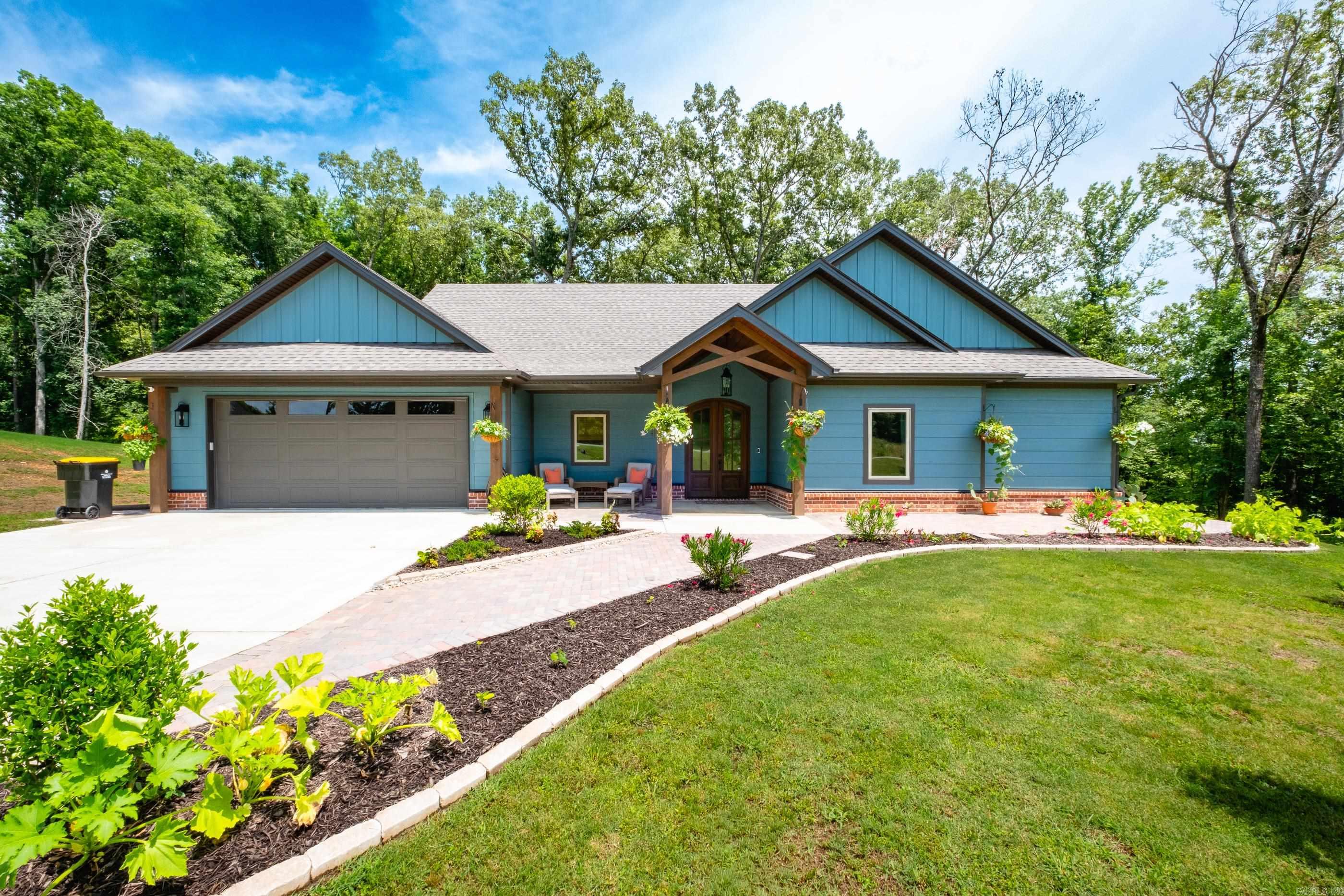 The best of both worlds, acreage but close to town, privacy and yet neighbors. This home draws you in with its stunning curb appeal and newly designed landscaping. Custom brick patios around the home offer the perfect place to relax and entertain. The home is immaculate and the upgrades that the owners have done make the home feel custom and warm. The kitchen features soft-close cabinet doors and top of the line stainless steel appliances. The family room features a brick fireplace and wood beams. Fabulous butlers pantry gives this home so much extra storage. This home is special.