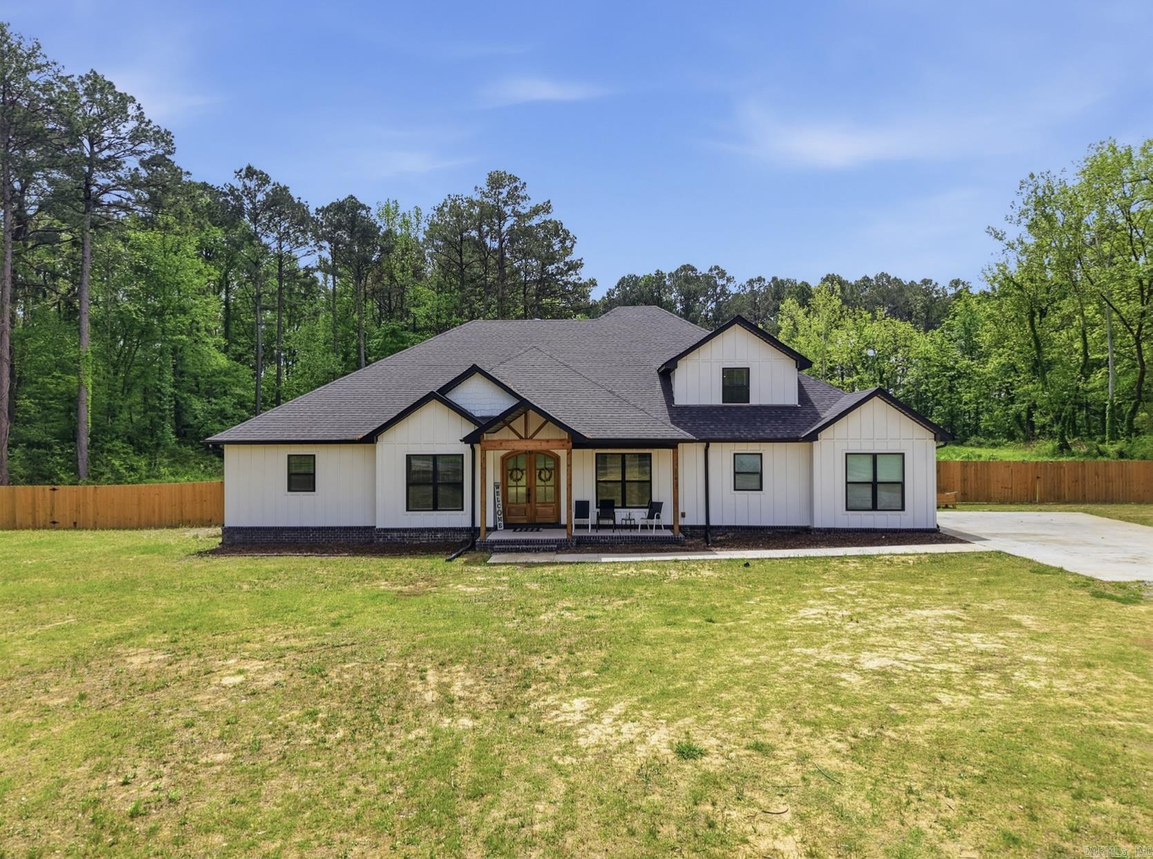 Built in 2024, this beautiful 4-bed, 2.5-bath home sits on 5.34 acres, offering modern design and peaceful country living. With 3,417 sq ft, this home features an open floor plan, natural light throughout, and high-end finishes. The spacious living area includes a gas fireplace, walk-in pantry and ample space for entertaining. In addition to the bedrooms, you’ll find a dedicated office, an upstairs bonus room, and a separate space currently used as a private salon. Each bedroom has a walk-in closet, while the primary suite offers a spa-like bath with a soaking tub, oversized walk-in shower, and large custom closet. Step outside and enjoy private acreage with your own pond and access to a shared neighborhood lake behind the property, with room to build a family compound, guest house, or expand in the future. Whether you're looking for space to relax or entertain, this property offers a rare combination of modern living and long-term potential combining space and privacy with a convenient location just 20 minutes from downtown Little Rock. Schedule your showing today—you won’t want to miss this one.