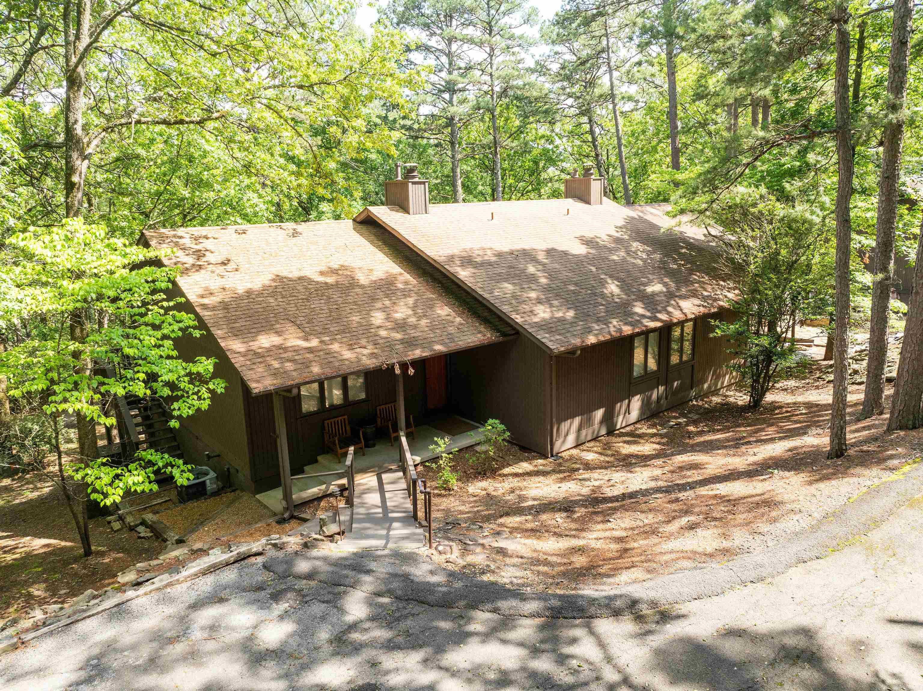 BEAUTIFUL EDEN ISLE CONDO, just a short walk to the RED APPLE INN!! The Eden Isle Marina is just a short golf cart ride away, so come enjoy the awesome Greers Ferry Lake. Features include gas fireplace, new counter tops, new appliances, some furnishings will convey, low maintenance flooring throughout, deck in the trees and a spectacular fire pit & sitting area. Deck overlooks private woods. Come see this condo and enjoy your time on Greers Ferry Lake and the wonderful Red Apple Inn.