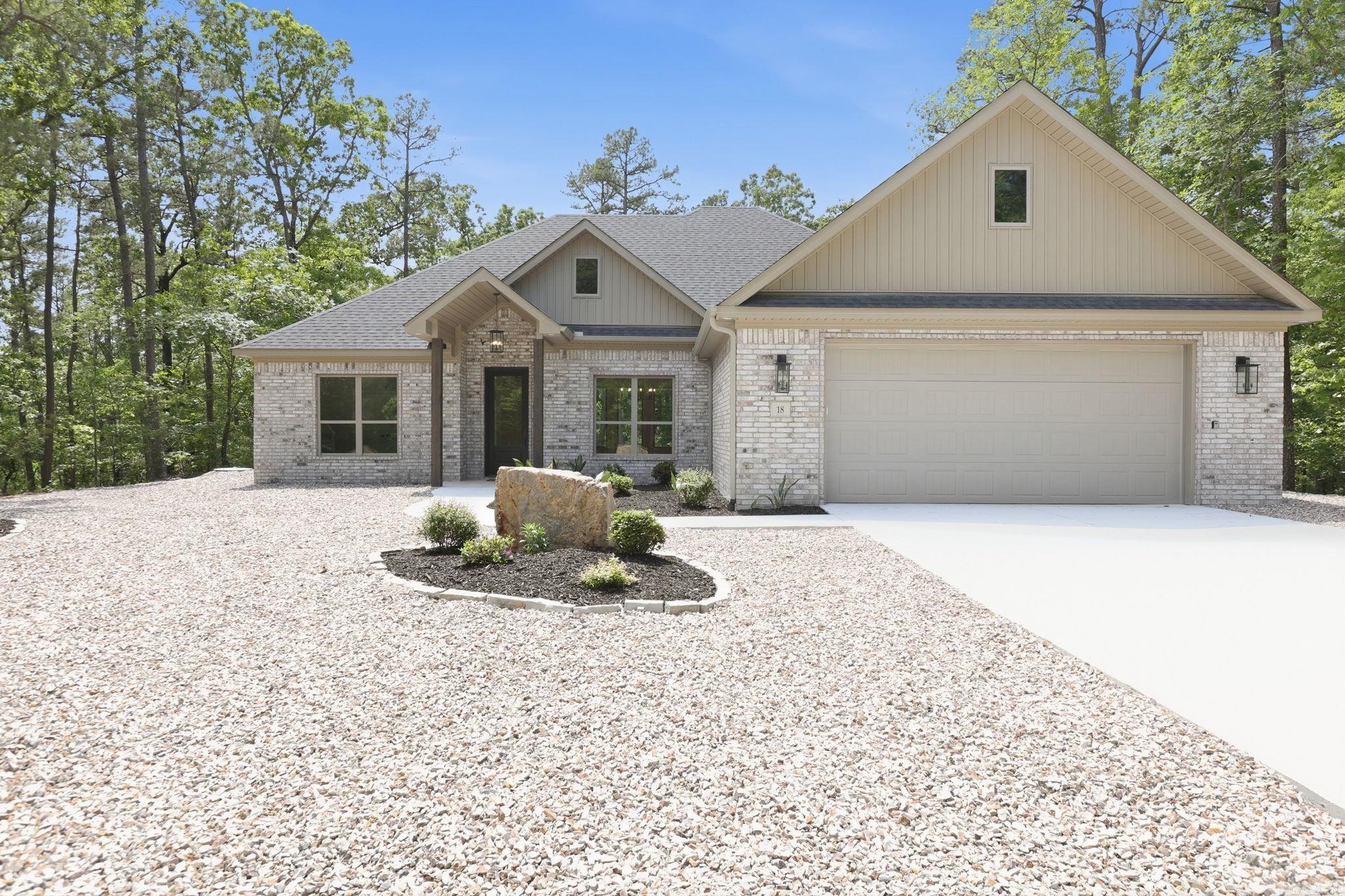 New construction modern home in Hot Springs Village featuring 3 bedrooms, 2 baths, and desirable one-level living on a flat lot. This all-brick home offers a bright open floor plan, split bedroom layout, and stylish finishes throughout. The kitchen features quartz countertops, custom cabinetry, stainless steel appliances, and a large island overlooking the living and dining areas. Spacious primary suite includes a walk-in closet and beautifully finished bath. Enjoy privacy and peaceful surroundings with low-maintenance exterior and energy-efficient construction. Ideal for full-time living, second home, or investment property. Located in gated Hot Springs Village with access to 11 lakes, 9 golf courses, walking trails, pickleball, tennis, dining, and more. Move-in ready with modern design and quality craftsmanship throughout.