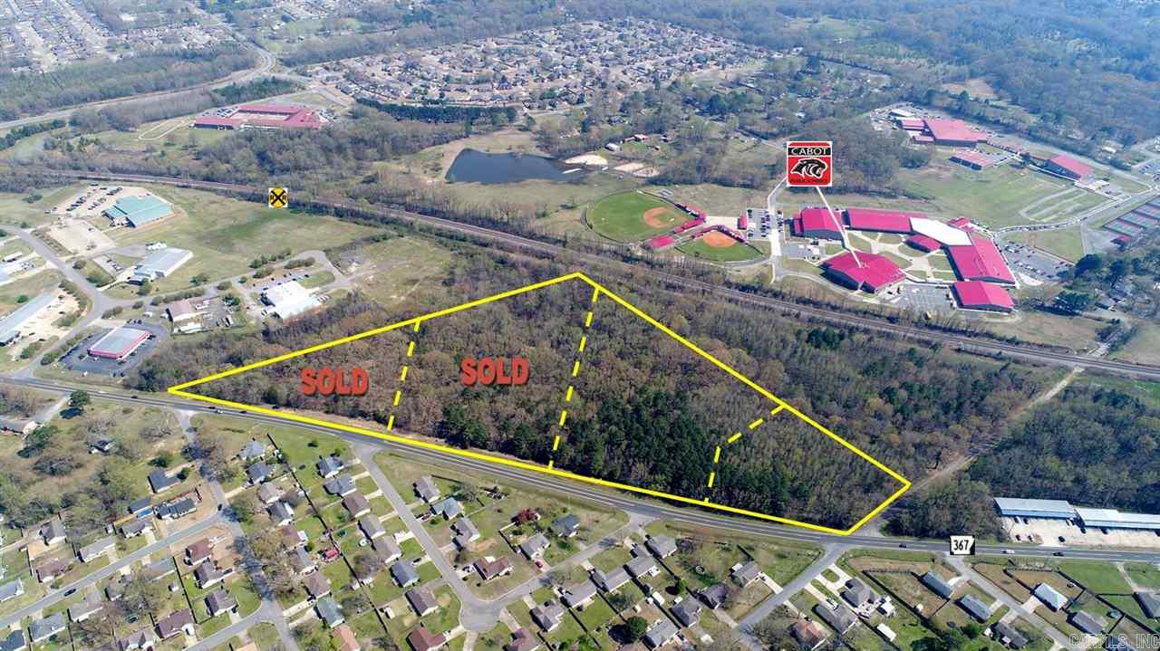 415' Frontage on corner of Polk St & Hwy 367/N Second.  Located just north of Harps Food Store, between Cabot & Austin.  Offers quick access to Hwy 67/167, Hwy 38, & Main Street.  Property is mostly level w/city utilities available.  Excellent location for large commercial, light industrial, or service based business. Other area commercial includes Cabot National Guard Armory, Hardee's, & Big Red. 21.02 Addtl acres available.  Seller will divide according to Buyer's needs.