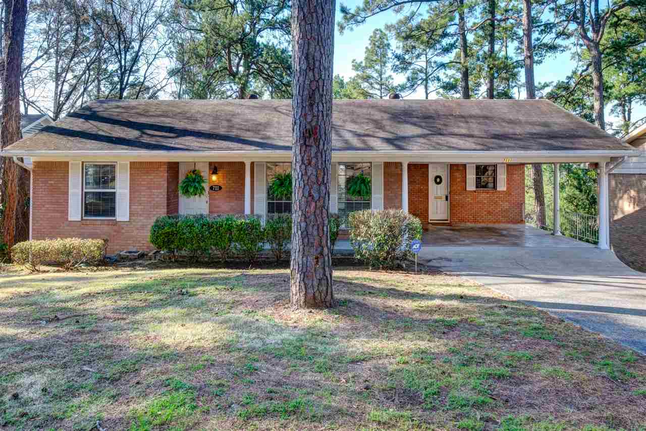 Midtown home close to UAMS. Master suite on the main level as well as second bedroom & second bath.  Refinished hardwood on the main level.  Quartz counter-tops in Kitchen. Open dining room & living room.  Downstairs offers an additional  living area (new carpet) with built-ins & ventless fireplace, & a 3rd Bedroom w/ en suite. Large laundry room.  Top of the line energy efficient complete HVAC.  2 car carport. Sewer lines replaced in 2005. Private backyard w/ large patio for entertaining or relaxing.