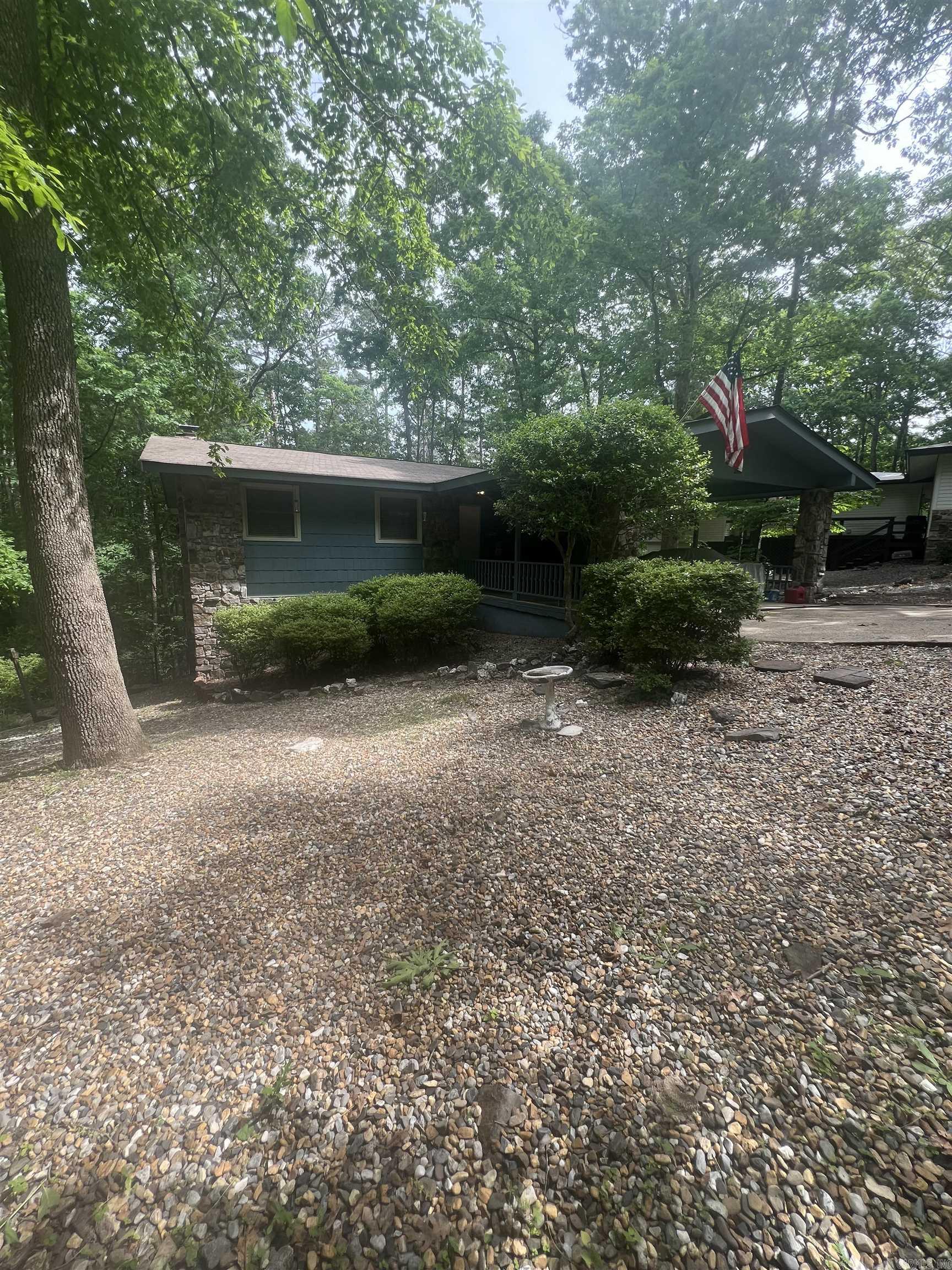 This beautiful 3-bedroom, 2-bath home offers 2,100 sq ft of comfortable living in a quiet neighborhood of Hot Springs Village. The two-story layout provides space and privacy, while the fenced backyard is perfect for pets, play, or relaxing outdoors. Enjoy year-round views from the Arkansas room on the back porch—an ideal spot for morning coffee or evening unwinding. The home has been well cared for and is truly move-in ready, with all appliances conveying to the new owner. A perfect blend of charm, functionality, and peaceful surroundings.