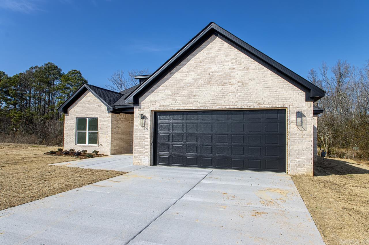 One of Bryant's Newest subdivisions.  Come check out this 4-bedroom home with a relaxing back porch.  This home has some extra trim throughout with tongue and groove ceilings in the living and custom beams in the primary bedroom.  Access from the primary closet to the laundry makes those chores easier.  Make your appointment today!