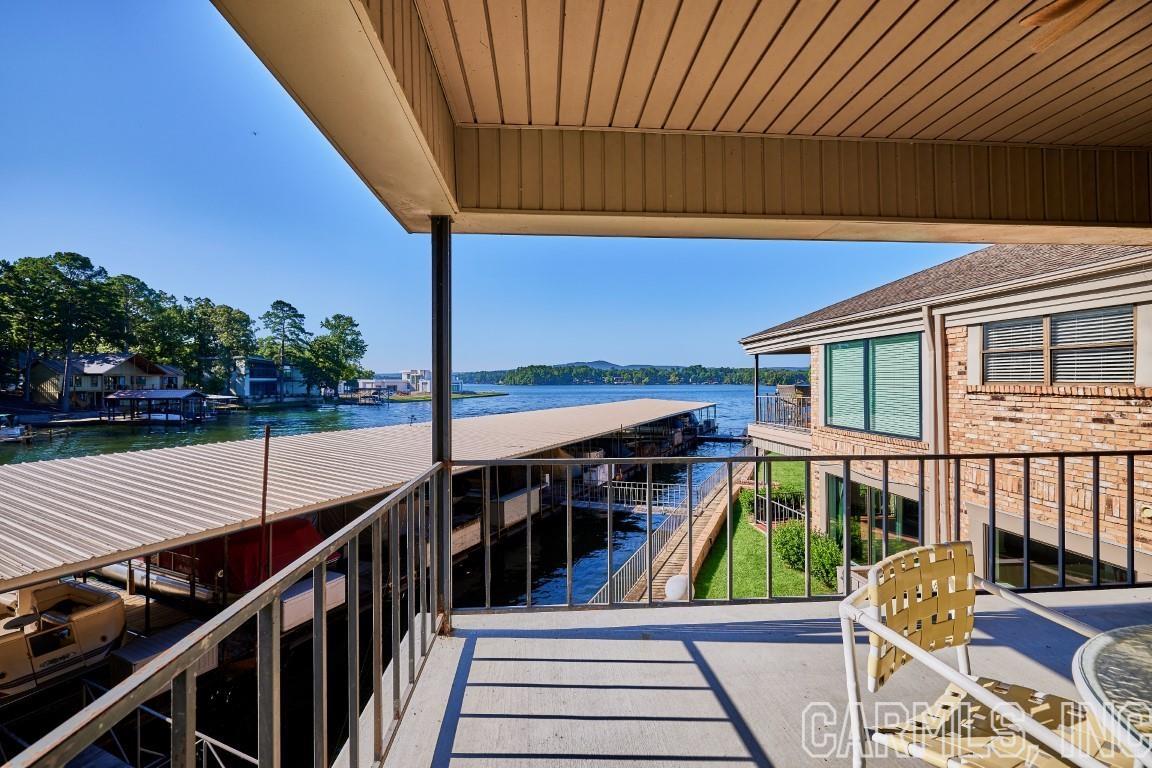 Scully Pointe, one of Hot Springs premier Lake Hamilton condominium developments is home to this beautiful upstairs (only 6 steps) unit.  Lovely park-like setting with a gated entrance, pool, and tennis courts. Minutes to Oaklawn, shopping, restaurants, and medical clinics. Two bedrooms with a third room that could be used as a bedroom, study, or game room.