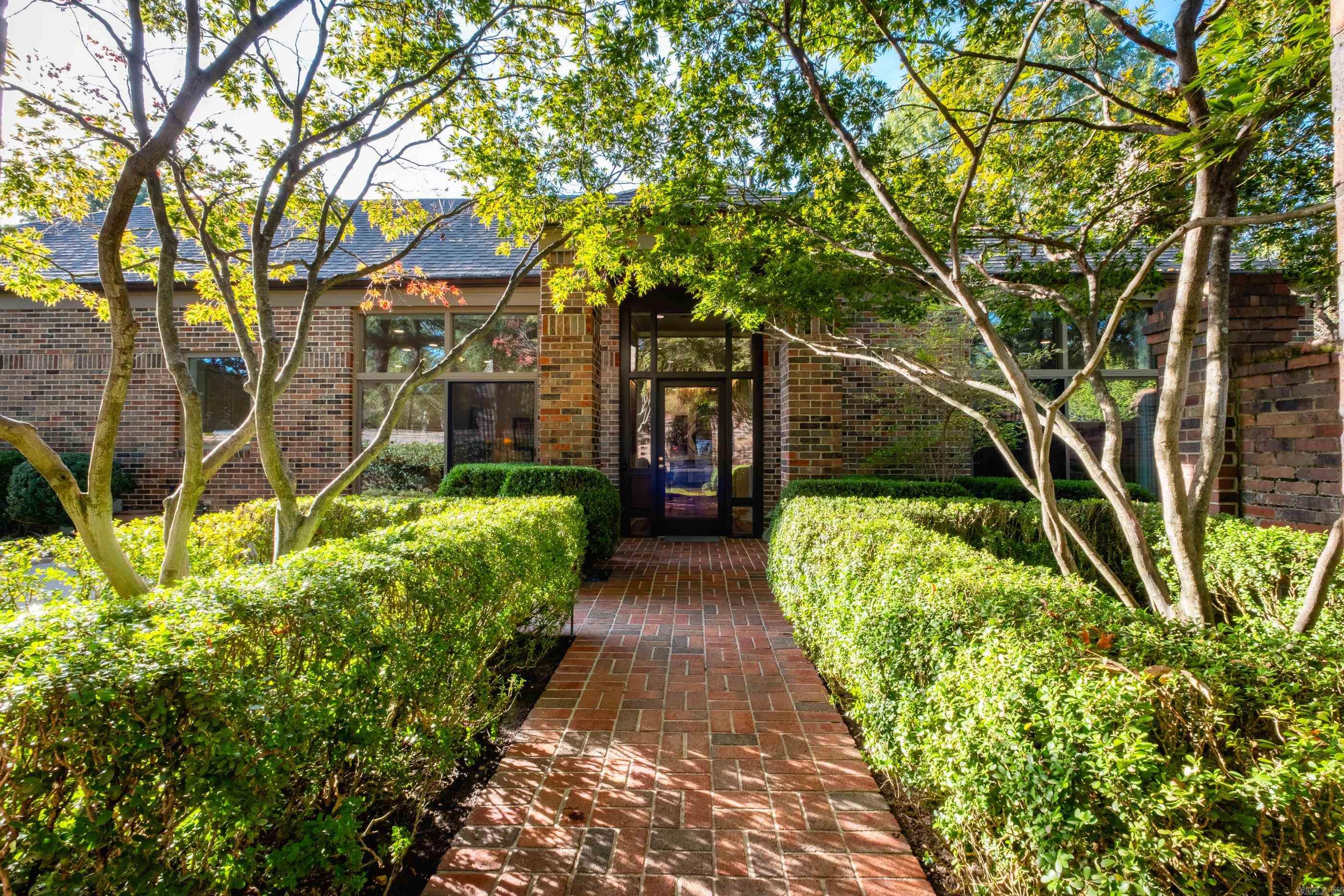 Elegant condo in gated Riverbend community offering privacy and security. Features 10’ ceilings, floor-to-ceiling windows, and site-finished hardwoods throughout. Open, light-filled layout with two living areas and formal dining. Chef’s kitchen with slab quartzite counters and backsplash, Bosch dishwasher, and bar with beverage fridge. Four ensuite bedrooms—two on main level, two guest suites up. Custom moldings, solar-protected windows, and multiple courtyards. Private walkway and pier to the river with views of the bluffs and downtown skyline. Side-entry garage with sink, heated & cooled storage, copper gutters, and new insulation. Exclude chandelier in the dining room. Walk in storage room as well!