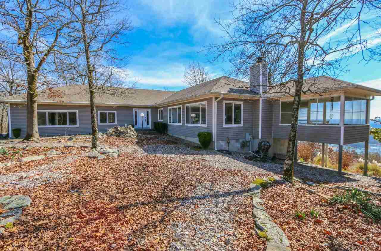 A Year round BEST mt. view in HSV. 3/2 on 2 lots. Builder's custom home. Heat, cook (kit aid cook top, grill- 20" thermador char-glo, 2 ovens),water heater,dryer: 500 gallon buried tank. Central vac, Stack stone FP 35,000 BTU w/gas logs. Br 3  sewing rm. MAbr 12x17 w/ closet 13'8" x 9'9". MA Ba: WI shower, whirlpool tub w/handicap bars. Office/game rm: 25'x27' sink & bkcases. Oversize Garage 23'6"x27'3". Screen porch 12'x16'. Oversize Great rm  27x27.  New roof 2010. See agent remarks. Alarm system.