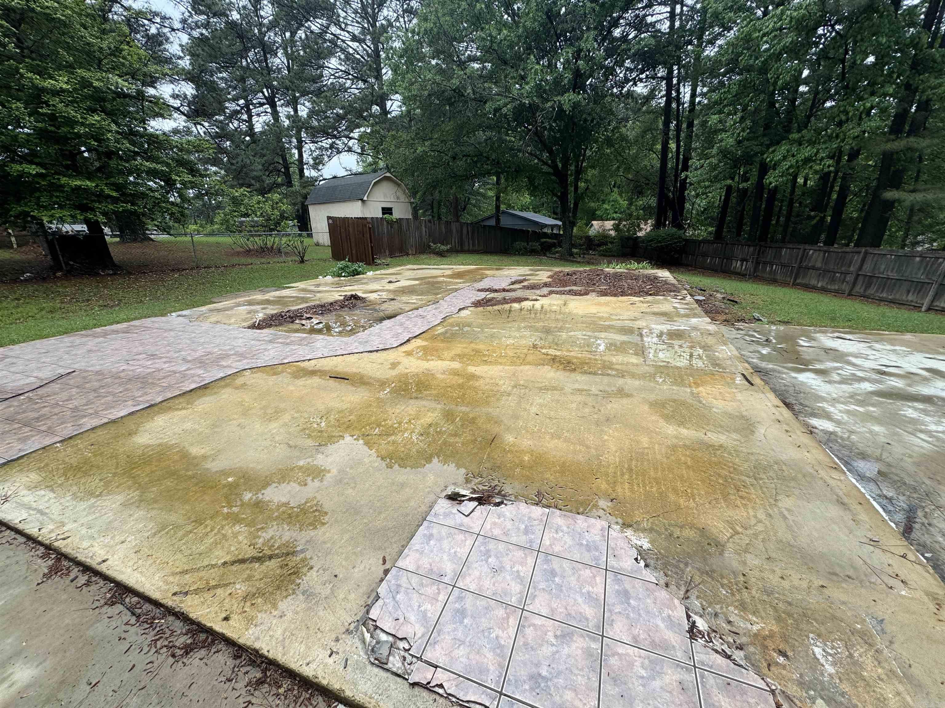Very nice lot with shade trees and existing fence.  There is a concrete slab from the previous home.