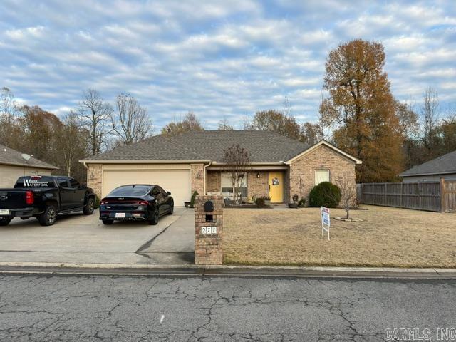 3 bedroom, 2 bath, beauty inside and out with fenced yard.   Split bedroom design.  Extra parking pad poured.   Really, really nice.