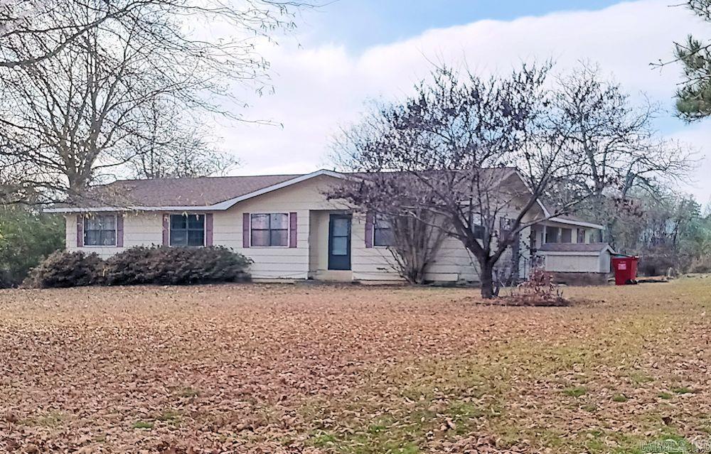 You can enjoy life in this exceptional country home in Vilonia, Arkansas - Featuring 5 bedrooms and two full bathrooms, a kitchen dining combo area, a living room and a den with a woodburning fireplace.  The home is situated on a large 1.85 acres corner lot with plenty of room for a garden and more.  Exterior storm cellar is on the property for added protection from storms.  Please call the listing agent today to view this home in person.  Two days advanced is requested.  Latitude/Longitude 35.122887°/-92.216748°