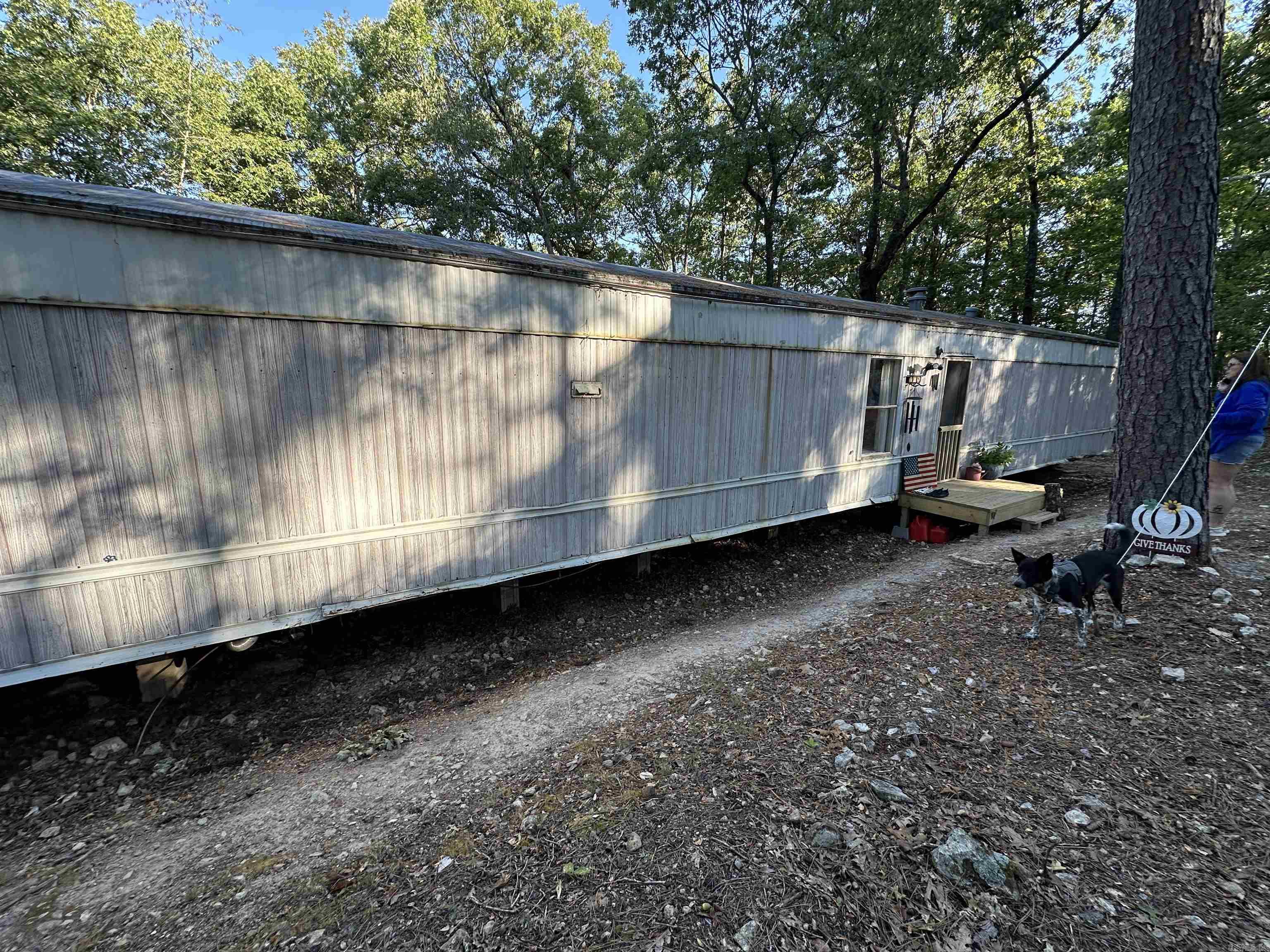 Looking for a little country freedom? This recently remodeled mobile home sits on 3.73 unrestricted acres m/l just outside of town and only ashortdrive to Bull Shoals Lake. Inside, the home has been updated within the past two years, offering fresh finishes and a comfortable place tosettlein. A newer septic system is already in place, and while a well is still needed, water is easily accessible through the local spring system.With norestrictions, you’ll have the flexibility to make the property truly your own—whether that means gardening, a few animals, or buildingoutadditional space. Enjoy peaceful country living while staying close to town conveniences and lake life recreation.
