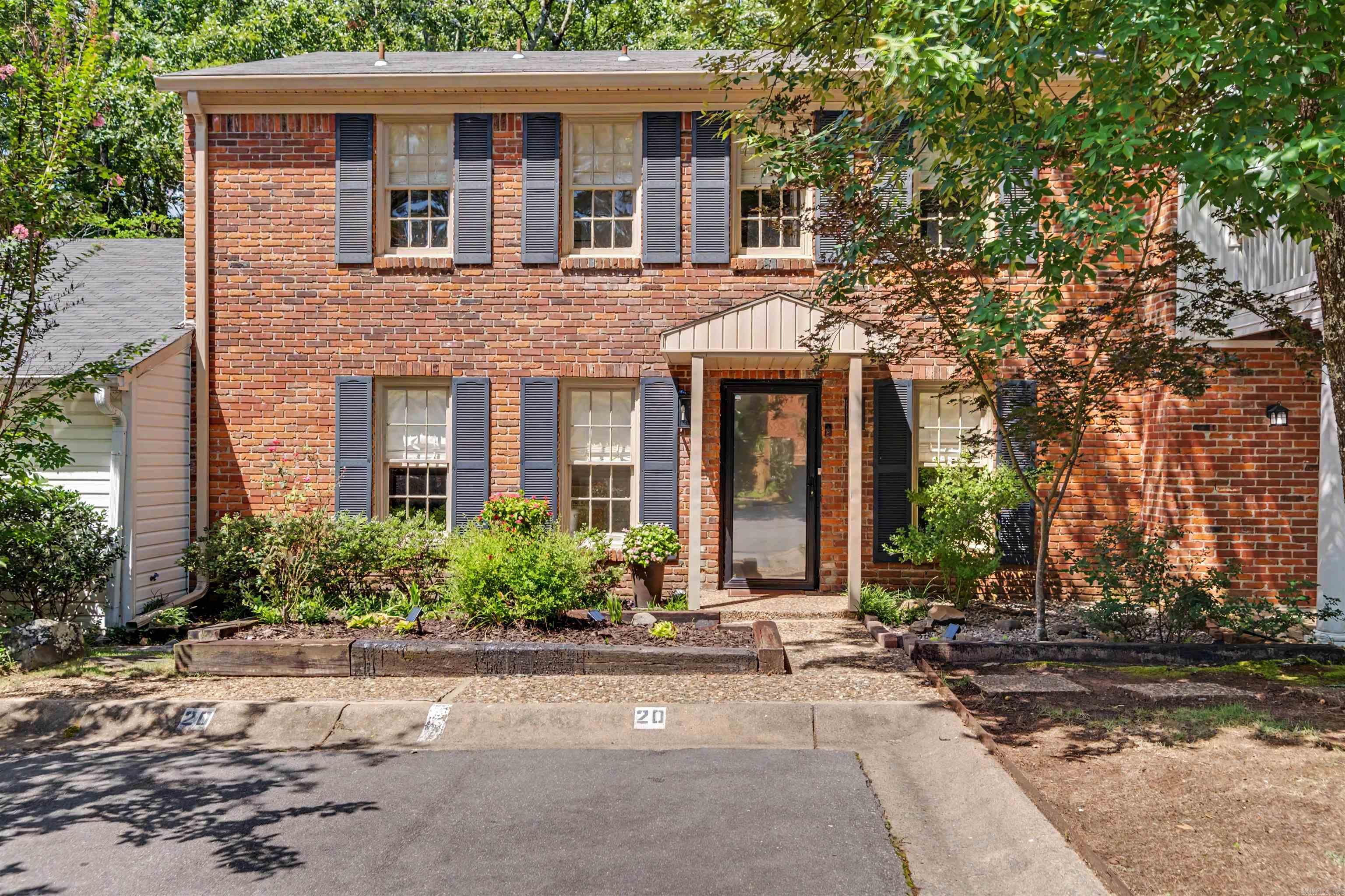 Wonderfully updated 3-bedroom Kingsbridge condo in the heart of Little Rock, just minutes from shopping, dining, and entertainment! The main level features a spacious living room with fireplace and built-in shelving, an updated kitchen with beautiful countertops, stainless steel appliances, and plenty of storage, plus a separate formal dining room and convenient half bath. Upstairs you'll find all three bedrooms, including the primary suite with a renovated private bath, two additional bedrooms, a second full bath, and laundry. Step outside to your own covered patio and private fenced courtyard, perfect for relaxing or entertaining. Designated parking and low-maintenance living make this home an easy choice. Kingsbridge residents enjoy wonderful community amenities including a clubhouse, swimming pool, tennis and pickleball courts, and beautifully maintained green spaces.