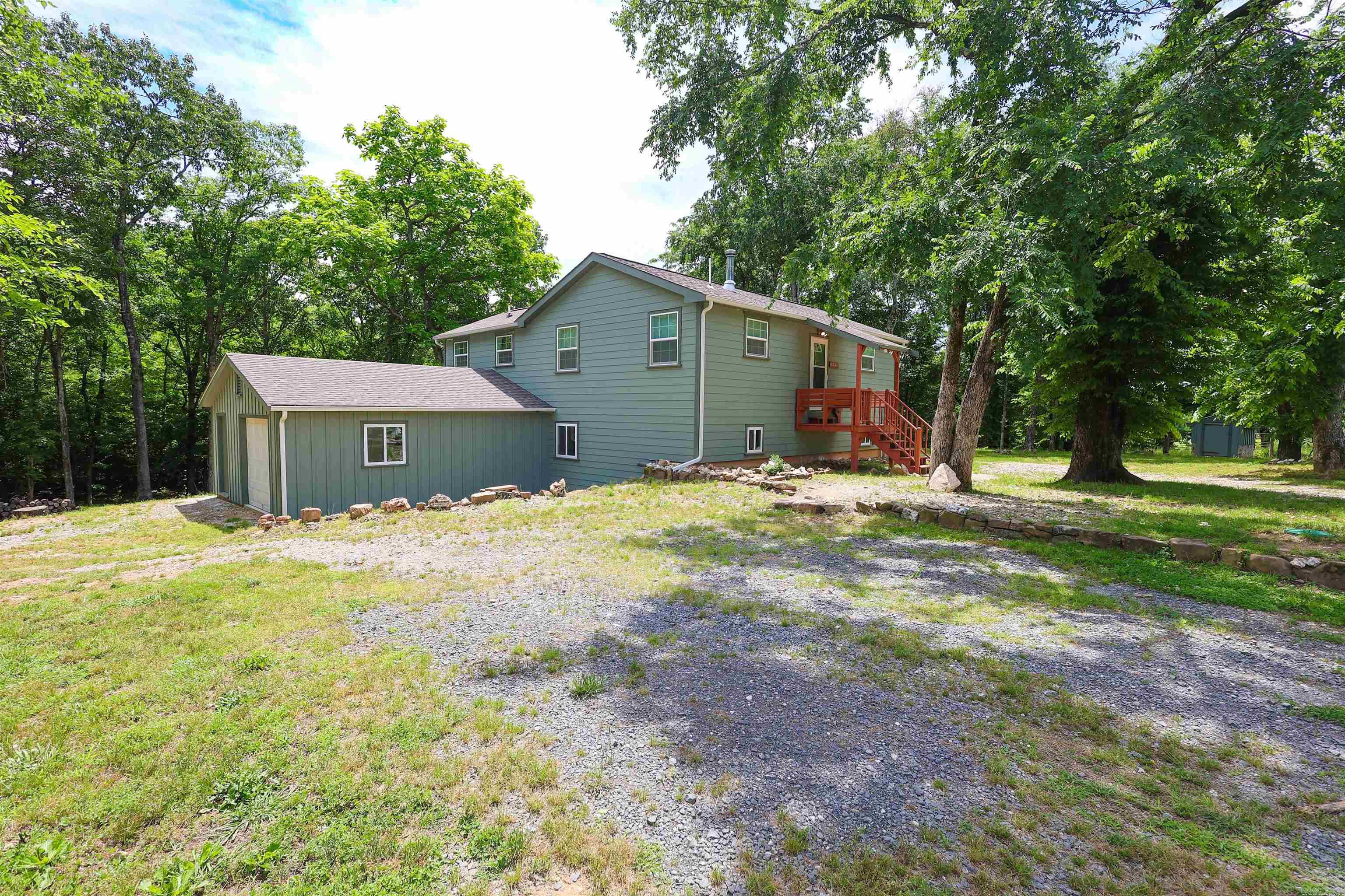 Tucked away on 4.26 ± wooded acres and joining the National Forest, this newly built 3-bedroom, 2-bath home offers the kind of setting outdoor enthusiasts dream about. Built in 2024 with quality craftsmanship throughout, the home features 2,008 square feet of warm and inviting living space highlighted by oak cabinetry, white pine countertops, pine floors, ceramic tile, and vinyl plank flooring. The open-concept layout blends rustic character with modern comfort, while the gas cook stove, mini split system, and wood heat create a cozy atmosphere year-round. Exterior features include Hardie Board siding, architectural shingles, a 20x22 attached garage, well and septic, a 50-gallon electric water heater, and 200 amp service already in place for future additions or expansion. Mineral rights convey with the property. Residents also enjoy direct access to Irons Fork Creek through the subdivision common area, offering easy access to the water for relaxing and recreation. If you’ve been searching for privacy, nature, and a move-in-ready home with modern rustic appeal, this property is worth a closer look.