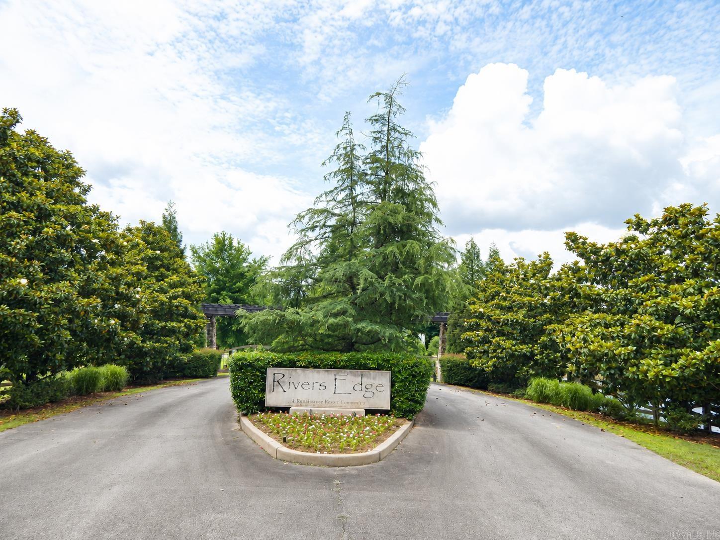 Build your dream home on this beautiful lot in the highly desirable Rivers Edge subdivision. Located just steps from the community pool, this exceptional property offers the perfect blend of convenience, privacy, and natural beauty.  Enjoy a gated entrance, community dock access, stunning mountain views, city water, and a private sewer system. The subdivision is designed for easy living, with all ground maintenance, private road upkeep, and pool access included.  Whether you're looking for a full-time residence or a weekend retreat, Rivers Edge provides a peaceful setting and outstanding amenities in one of the area's most scenic locations.