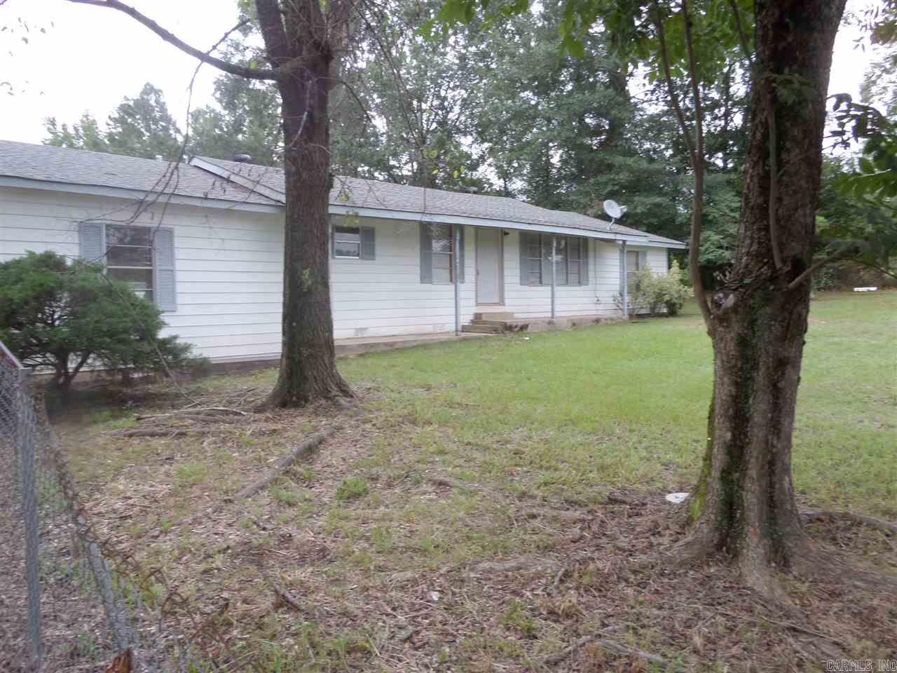 3 bedroom 2 bath home on 2.5 acres. Large utility room, additional outside canning kitchen/storage. Back yard is chain link fenced.  Property is partially privacy fenced.  30' x 50' heated and cooled dream shop on slab, includes car lift and 55 gallon air compressor.  Also includes 20' x 40' enclosed camper shed with concrete floor, electric (includes 220).  Roof less than 6 months old.