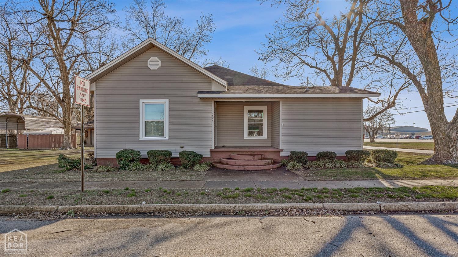Charming corner-lot 2BR/2BA in Monette, close to Buffalo Island Central High School and the city park. Enjoy an inviting family room plus a cozy den with a fireplace. The bright kitchen features white cabinets and quartz countertops, and there's a dedicated laundry room for convenience. Relax in your very own sunroom. The primary suite offers generous space and a well-appointed bath with a large jet tub and walk-in shower. A standout bonus is the large mechanic shop, perfect for projects, hobbies, or extra storage, plus a two-car attached carport and an on-site storm shelter for peace of mind. Flexible floor plan offers the potential to convert to a 3-bedroom while maintaining 2 baths (buyer to verify). Come see all this home has to offer. Schedule your showing today!