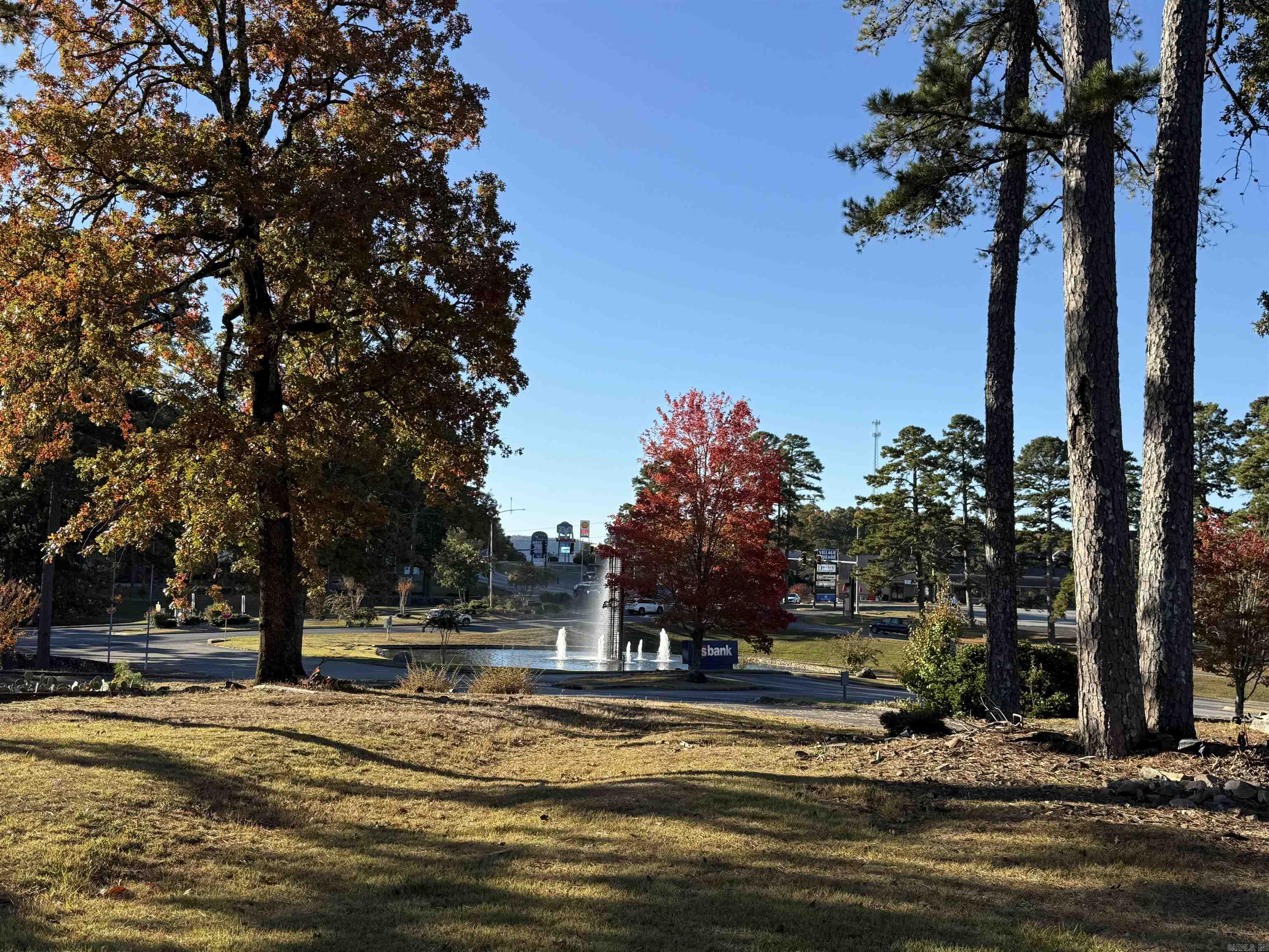 Prime commercial opportunity at the West Gate of Hot Springs Village! This highly visible property is perfectly positioned at one of the community’s most traveled entrances—where the original Cooper Sales Offices were located. Featuring level building sites with utilities to the property, this location is ready for immediate development. A paved road and existing parking area are already in place, offering excellent accessibility and convenience for clients, guests, or future tenants. With its commanding exposure to daily traffic entering and exiting the Village, this parcel is ideal for professional offices, retail, medical, hospitality, or mixed-use development. Surrounded by established businesses, golf, and residential neighborhoods, it provides the perfect setting for your next commercial venture. Premier location, easy access, and endless potential—this is the gateway to success in Hot Springs Village!