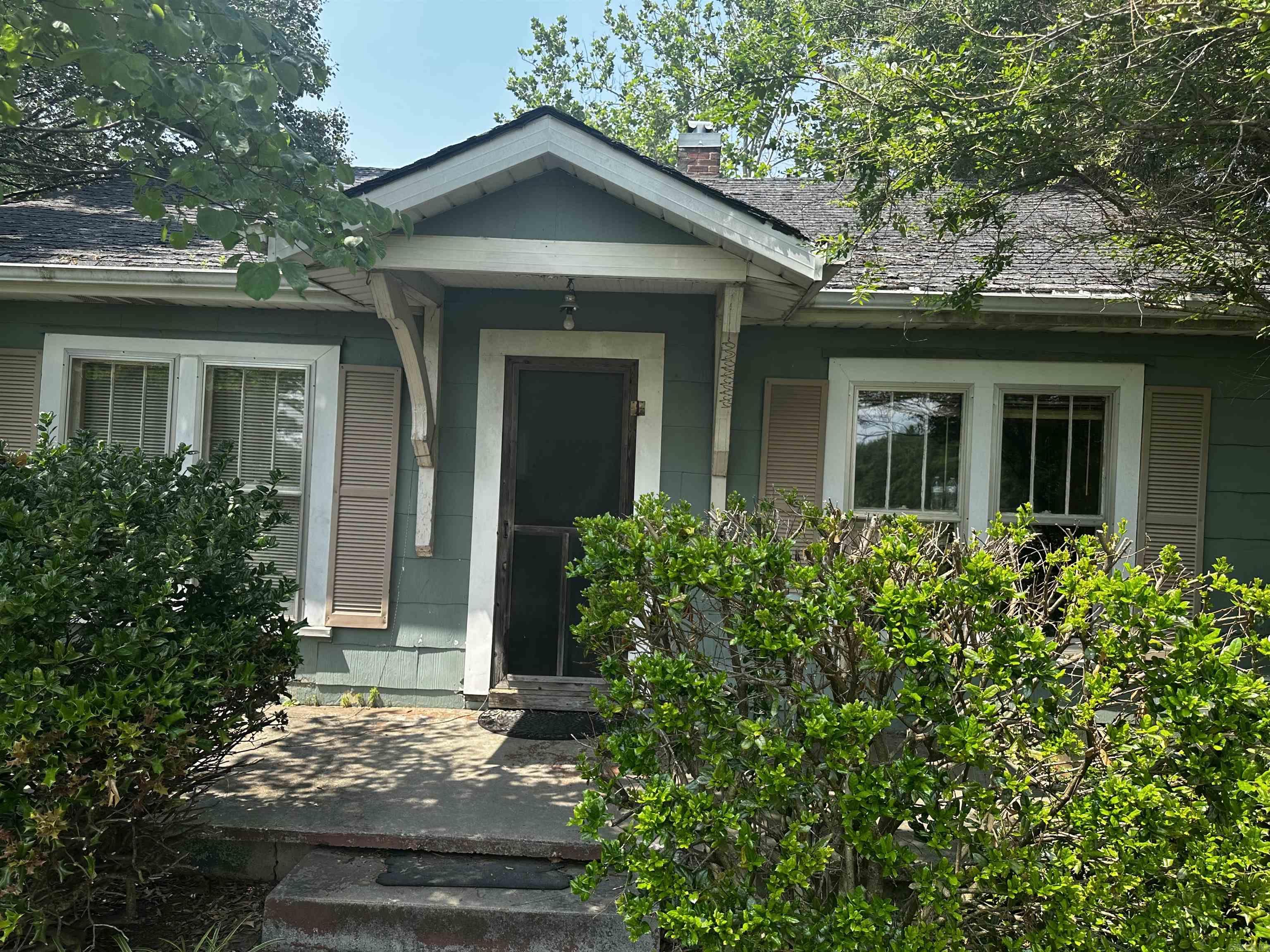 property is deep rather than wide  it consists of an older 1474 sq ft house and a much new 1,200 square ft shop with 5 YR. roof & utilities.  Price includes $15,000.00 in buyer’s concessions to use as closing costs. Down payment, or upgrades and repairs