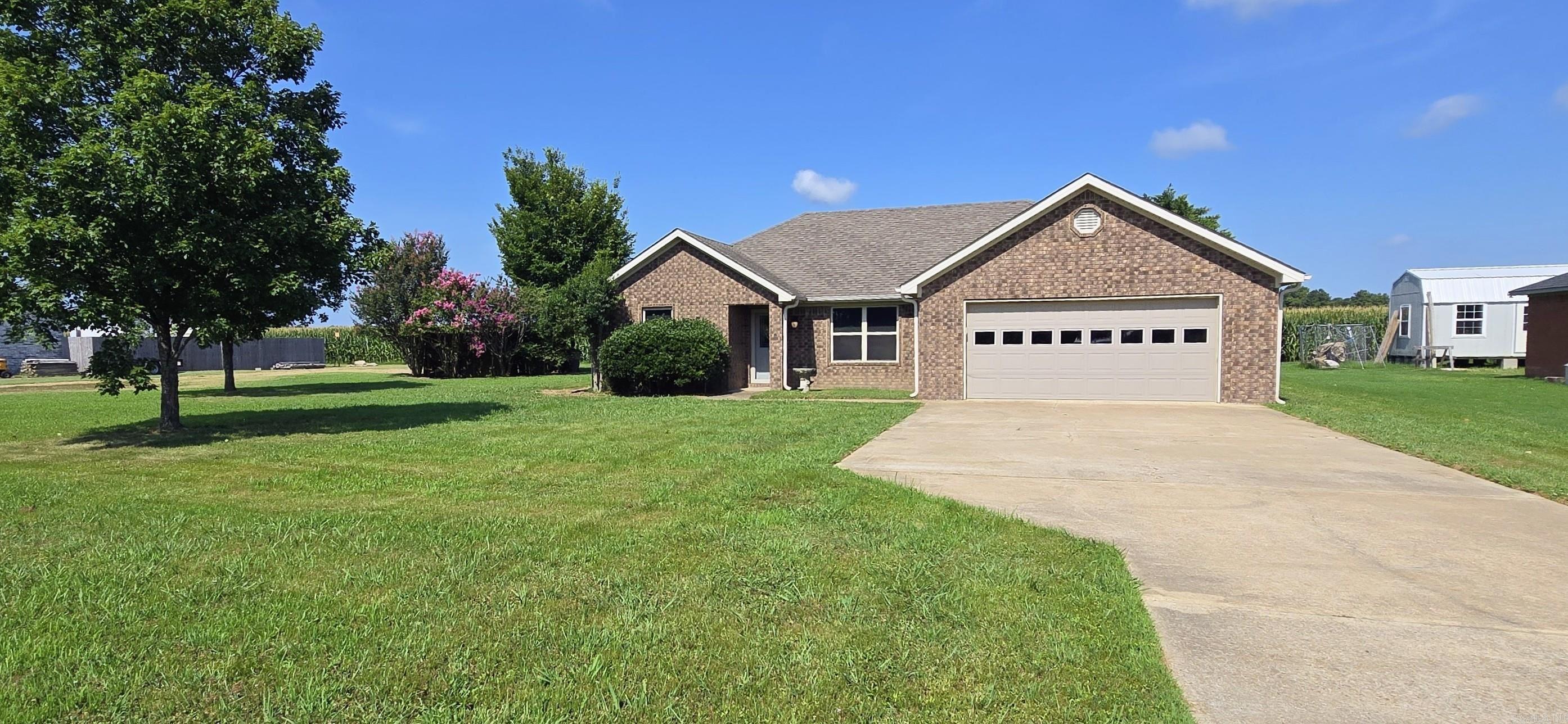 Move-In Ready!!     Well-maintained 3 bedroom, 2 bath home located at the edge of town providing that country feel within Wynne city limits. This home has been updated with new paint, wood-look tile flooring, electric central heating and air replaced in 2020, 2 inch blinds throughout, and a large walk-in closet and walk-in shower in the primary bath. Roof was inspected and found to be in good condition. The 2-car garage and extra parking pad provide plenty of parking.  You'll find a spacious kitchen and dining combo that includes a free-standing electric range, microwave, dishwasher, garbage disposal, and ice maker connection. This all electric home includes electric washer and dryer hookups and electric water heater replaced in 2022. This move-in ready home offers comfort, functionality, and low-maintenance living with a practical layout and desirable features.   Schedule your private tour today and see everything this home has to offer!