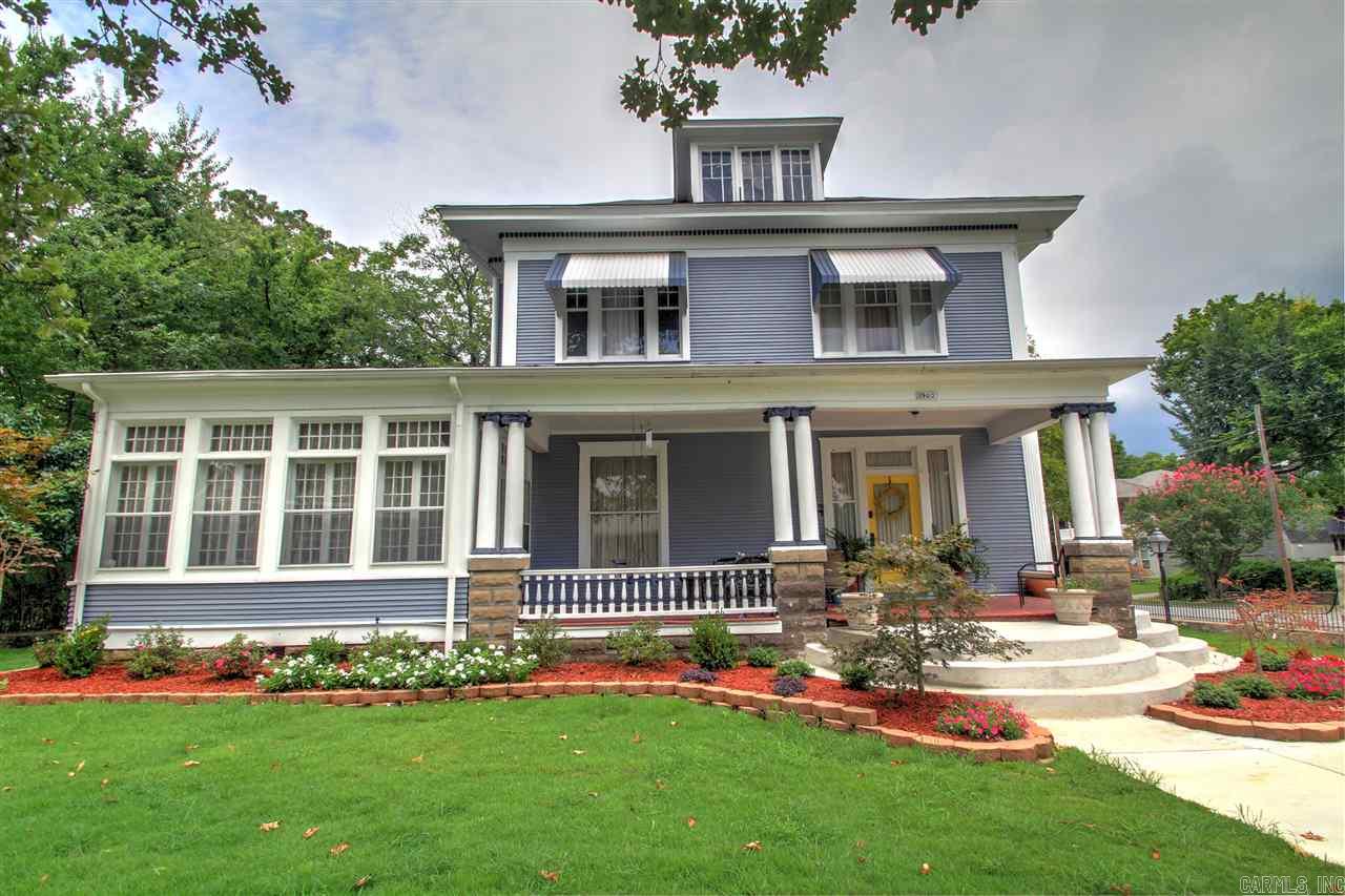 Charming 4 bedroom & 2.5 bath historic home on corner lot with an additional detached 2 bedroom & 1 bath 964 sqft in-law living quarters currently leased for $550 per month.  Home has beautiful hardwood floors & lots of moulding. Very large dining, living, &  sun rooms. All bedrooms are roomy & MBR has large sitting area. There's also a full walk-in attic & basement with interior access. Front steps recently remodeled and new landscaping completed. Come check out this beautiful home and make it yours!!!