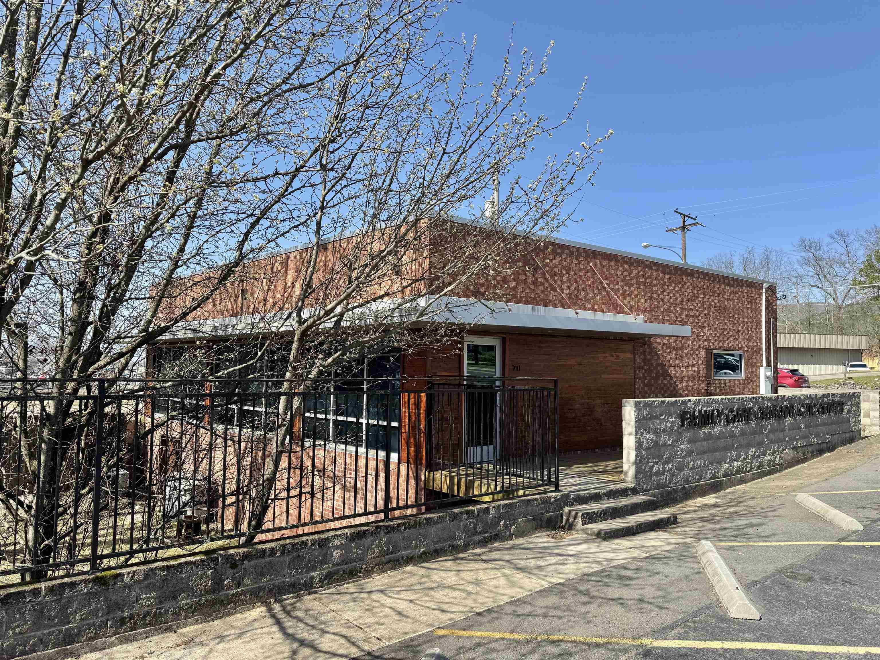 Prime commercial property for sale in a high-traffic location on Albert Pike Road in Hot Springs with daily traffic counts of approximately 23,000 vehicles. Former chiropractic clinic offering a functional layout ideal for medical office, wellness center, professional office, salon, counseling practice, or other service-based business. Property features include large reception/lobby area, 5 private treatment/exam rooms, bathroom, kitchen/break area, separate shower and 12 on-site parking spaces. Separate entry and exit provide convenient access for clients and staff. Full basement extends under the entire building, offering exceptional storage, workspace, or expansion potential. Fully fenced yard provides added privacy and security. Excellent visibility, easy access, and flexible use potential in a strong commercial corridor. Great opportunity for owner-occupant or investor.